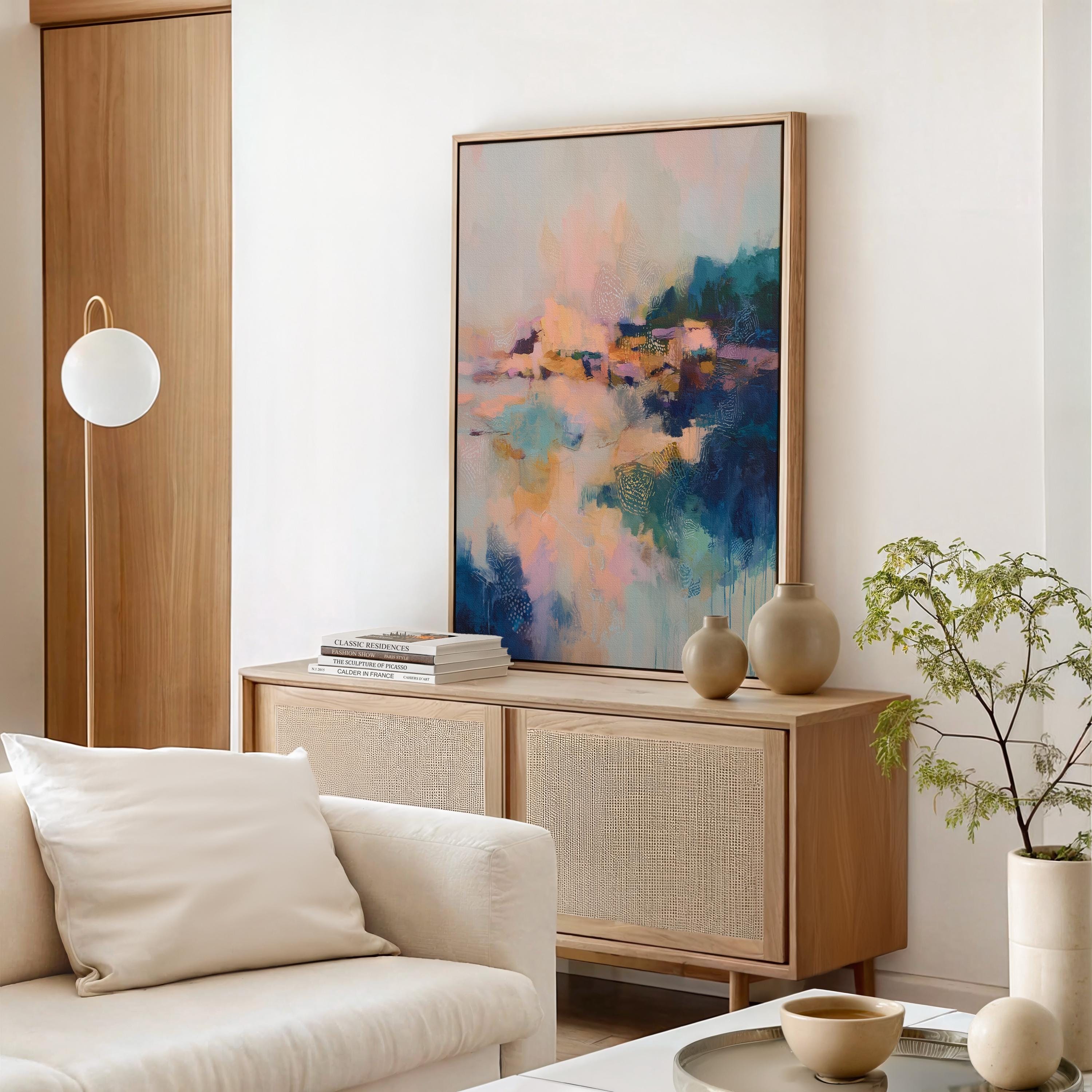 Harbor Sonata No. 1062 by Muse Studio & Co. teal peach gold abstract wall art printed with museum-grade giclée inks on premium gallery-wrapped artist canvas and framed in a custom wood float frame available in natural, white, black, antique gold, and antique silver, styled as large modern wall art in a serene designer living room.