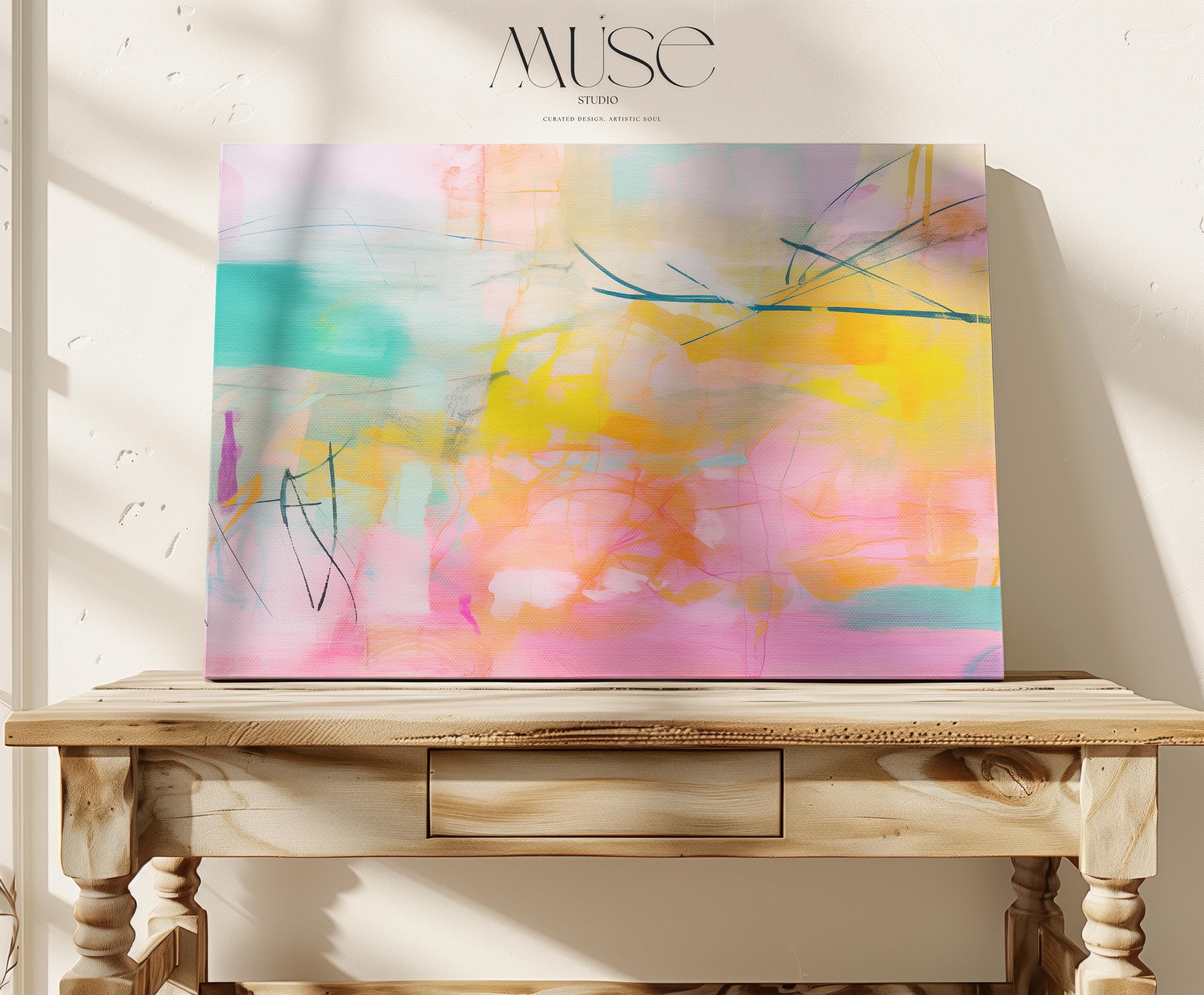 Large horizontal abstract wall art by Muse Studio in pink, citrus yellow, and soft turquoise printed with museum-grade giclée inks on premium gallery-wrapped artist canvas, styled in a whimsical nursery above a light wood crib.