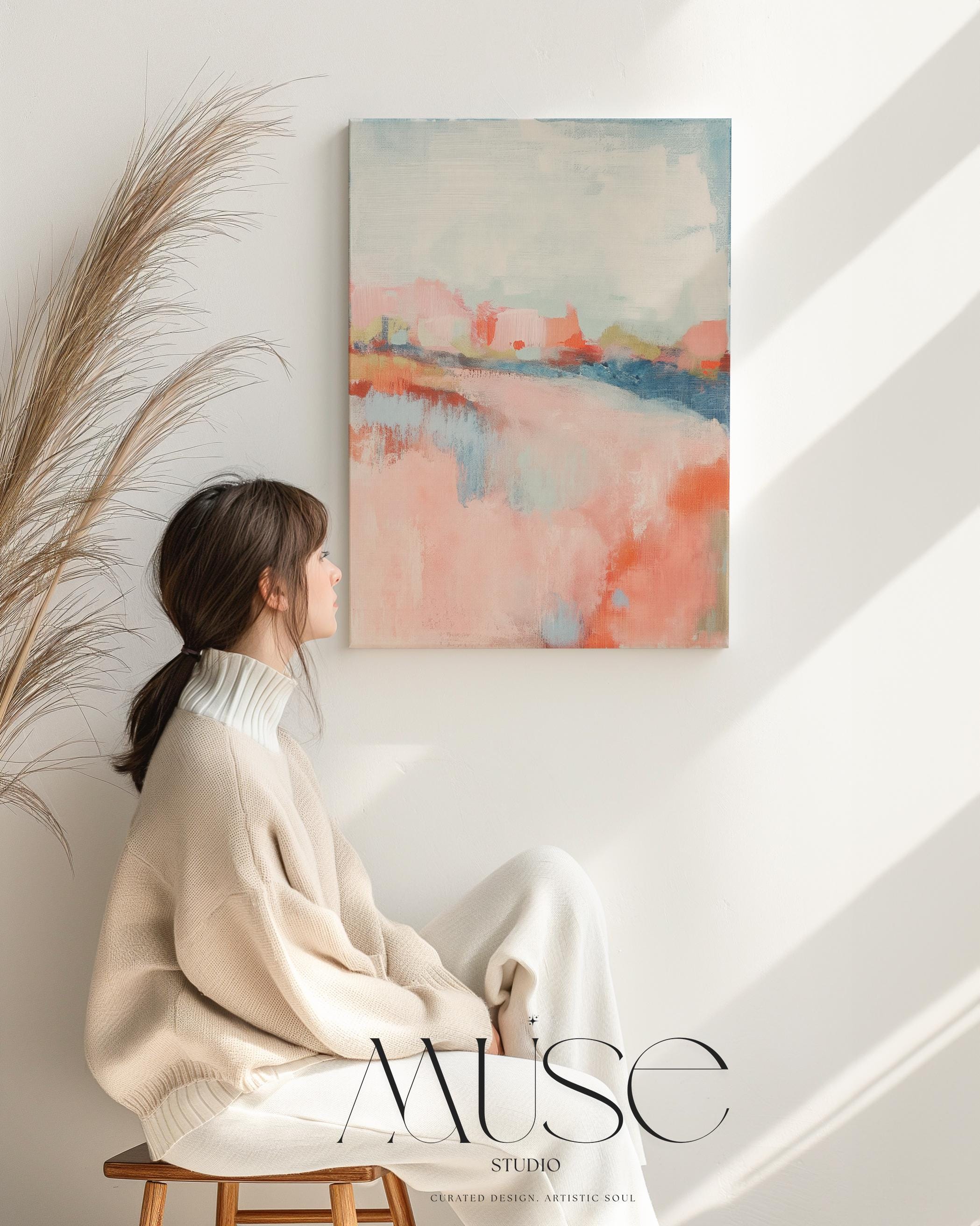 Abstract landscape canvas art featuring coral, soft blush, and blue tones in a peaceful painterly composition. Inspired by nature’s horizon, this vertical piece pairs beautifully with transitional, boho, or serene bedroom decor. Available as a fine art poster or canvas wall art for curated, color-forward decor.