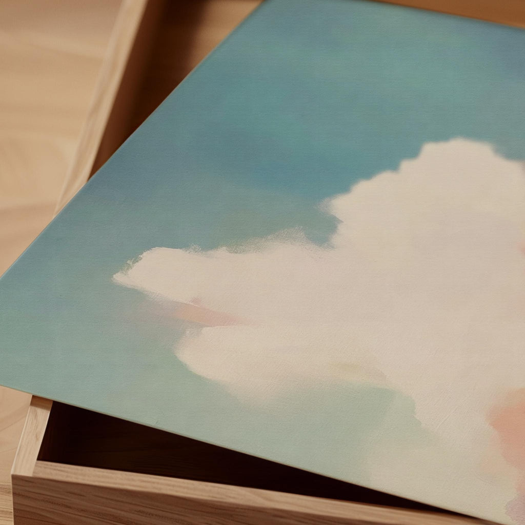 Square abstract canvas wall art of a soft pastel sky with cloud and ocean horizon. Blush, coral, and teal tones create a warm minimalist aesthetic ideal for modern bedrooms or calm office decor. Available as a fine art giclée print for framing in curated interiors.