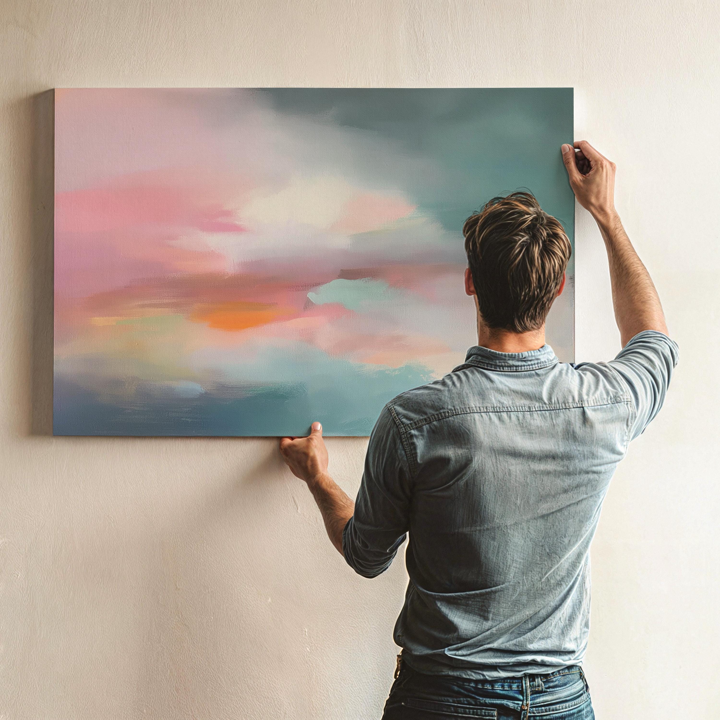 Horizontal abstract canvas wall art in soft blush, coral, teal, and gold tones, evoking a peaceful pastel sky over a modern landscape. Perfect for large living rooms, bedrooms, or transitional spaces. Available as a fine art poster or canvas wall art for curated, color-forward decor.