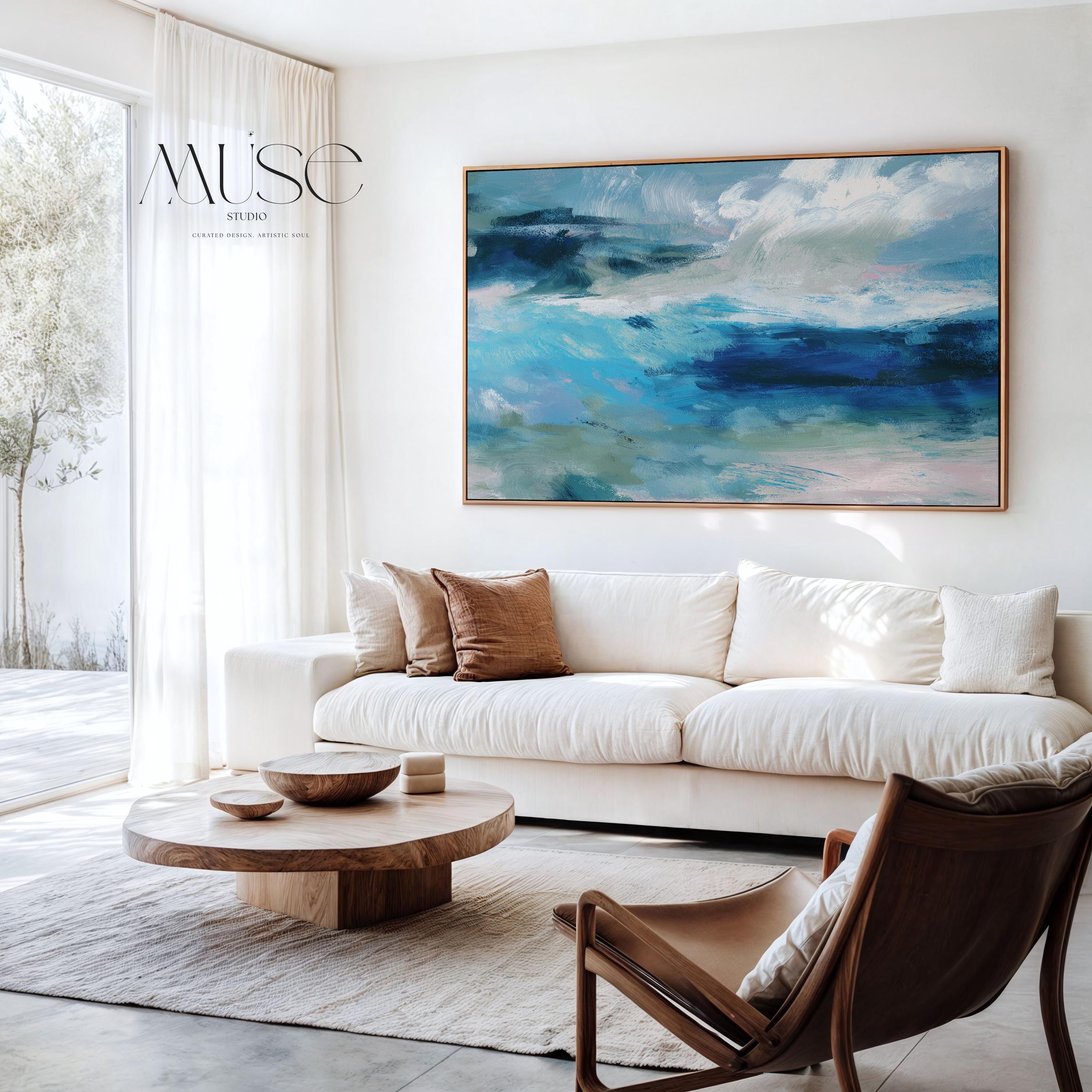 Framed horizontal canvas wall art featuring a coastal abstract with soft blue, sage green, and navy brushstrokes. Designed in a calming, fluid style ideal for beach house interiors, coastal living rooms, or nature-inspired decor. Available as a fine art poster or canvas wall art for curated, color-forward decor.