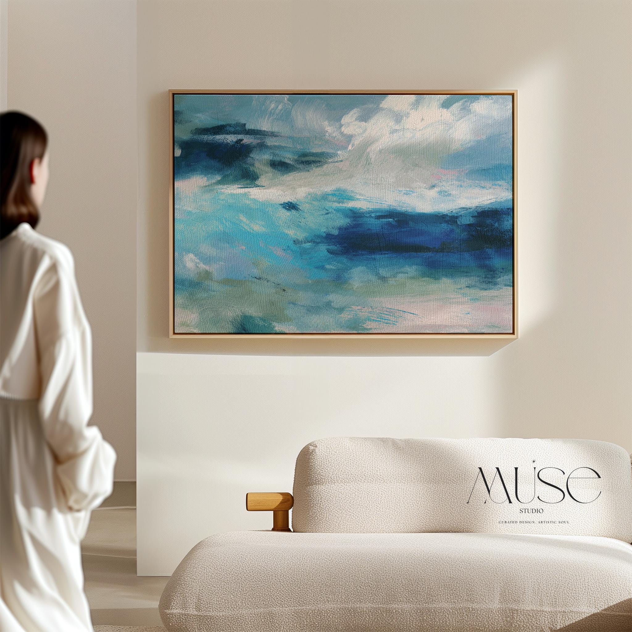 Framed horizontal canvas wall art featuring a coastal abstract with soft blue, sage green, and navy brushstrokes. Designed in a calming, fluid style ideal for beach house interiors, coastal living rooms, or nature-inspired decor. Available as a fine art poster or canvas wall art for curated, color-forward decor.