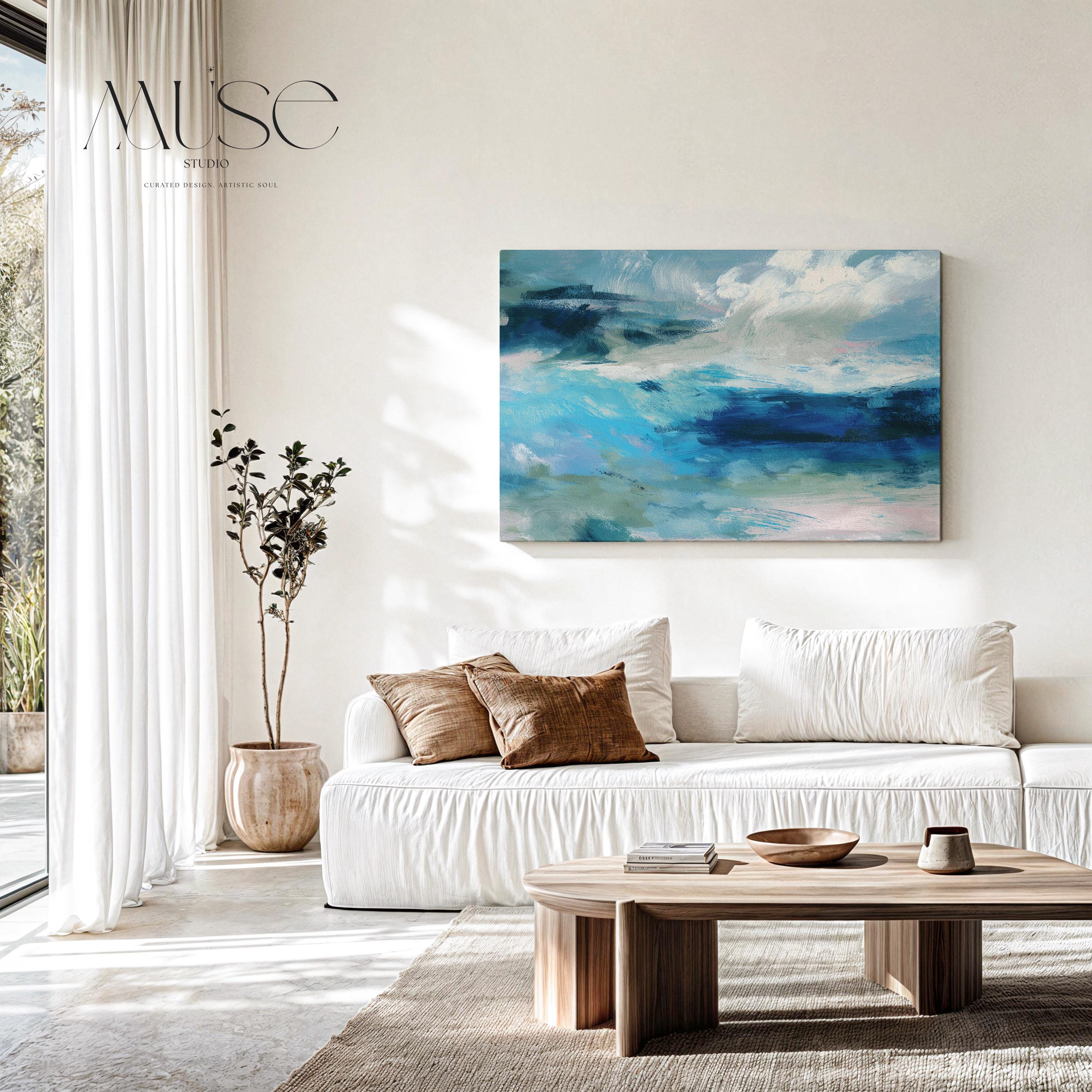 Horizontal coastal canvas wall art featuring layered strokes of ocean blue, sage green, and soft white in an abstract seascape style. Designed for serene, nature-inspired interiors like beach houses, living rooms, and entryways. Available as a fine art poster or canvas wall art for curated, color-forward decor.