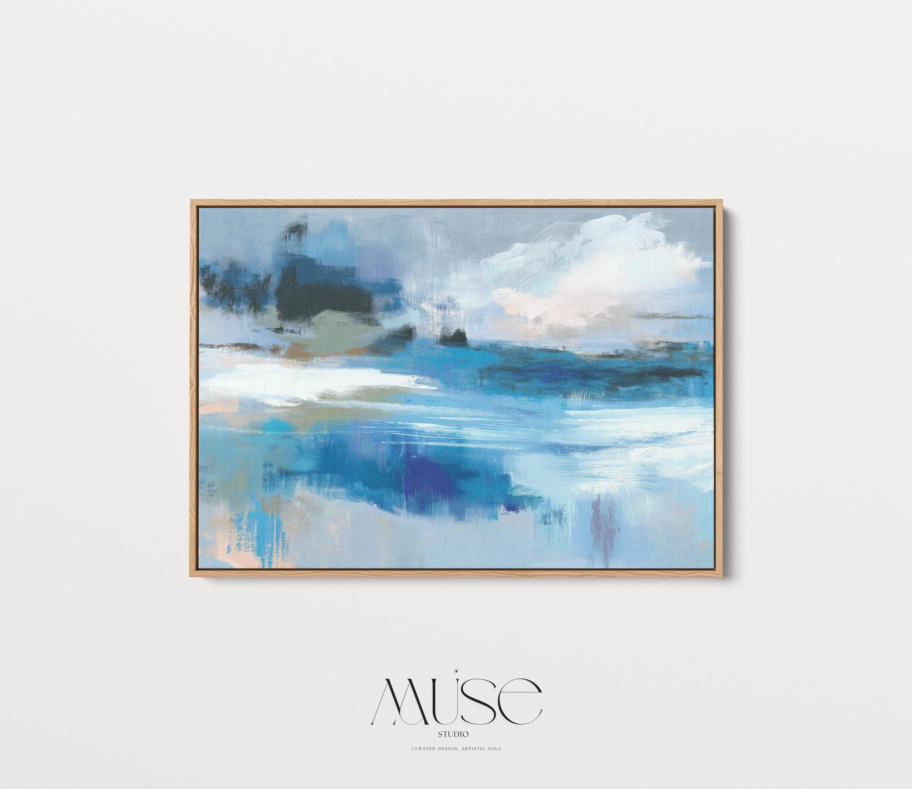 Framed horizontal wall art featuring soft painterly layers of ocean blue, sand beige, and sky tones in a modern coastal abstract. Ideal for beach house living rooms, transitional interiors, or above sofa placement. Available as a fine art poster or canvas wall art for curated, color-forward decor.