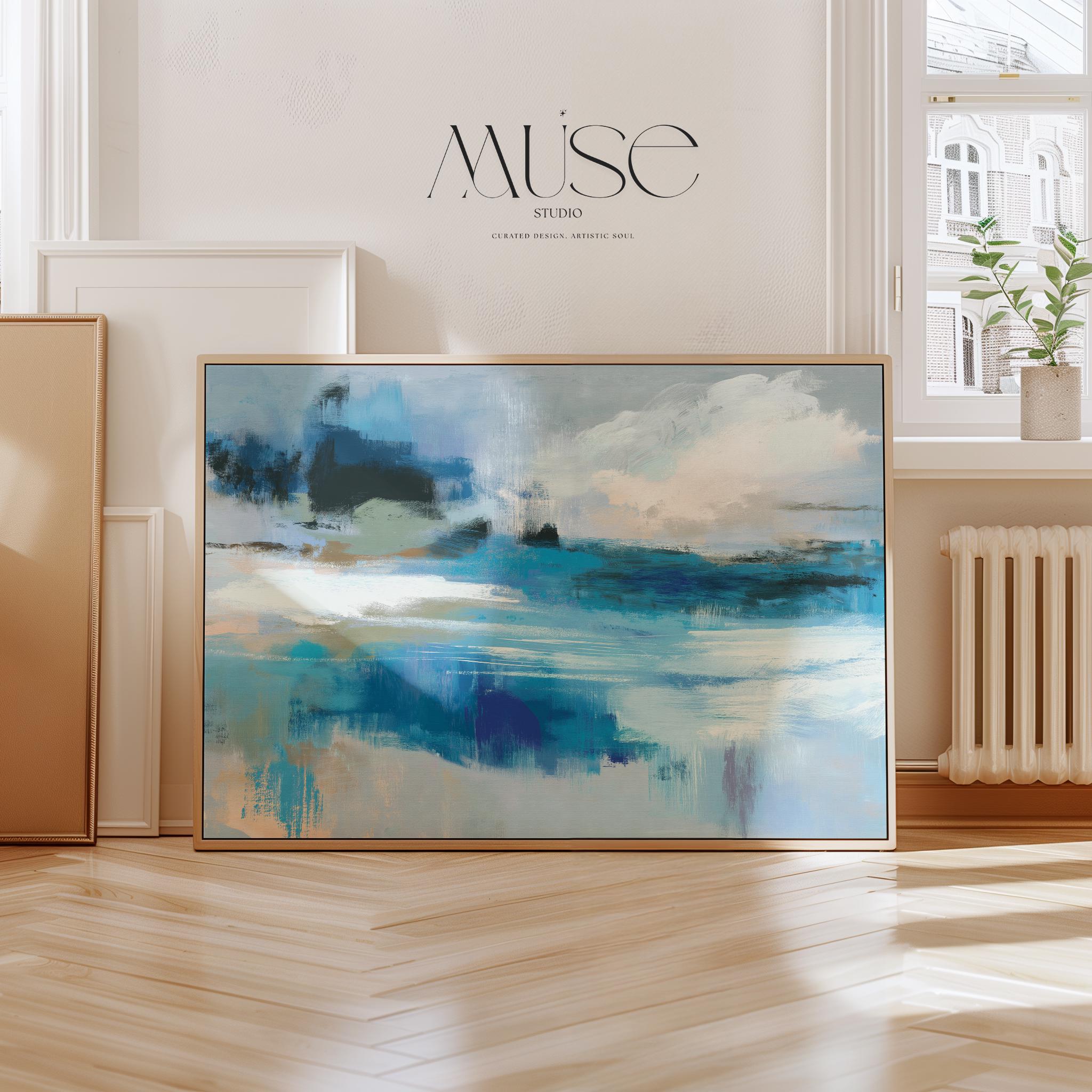 Oversized blue coastal abstract wall art with soft white clouds and ocean-inspired brushstrokes, leaning against paneled walls in a sunlit room. Muted coastal horizon artwork available as framed wall art, canvas, or fine art print by Muse Studio.