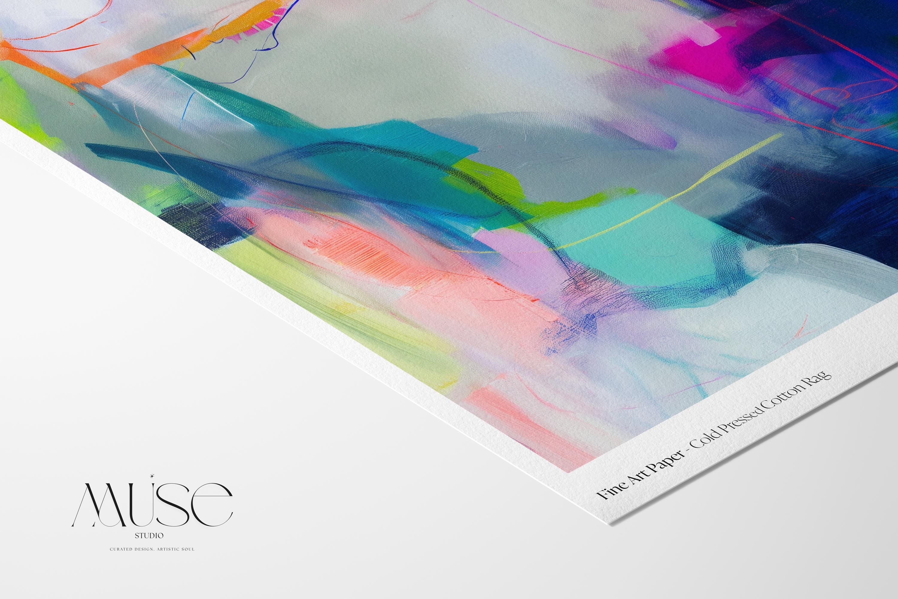 Large horizontal abstract wall art in bright blue, neon pink, teal, and multicolor tones displayed above a white sofa in a modern neutral living room with natural light and minimal decor. Vibrant color pop artwork available as framed canvas or fine art print by Muse Studio.