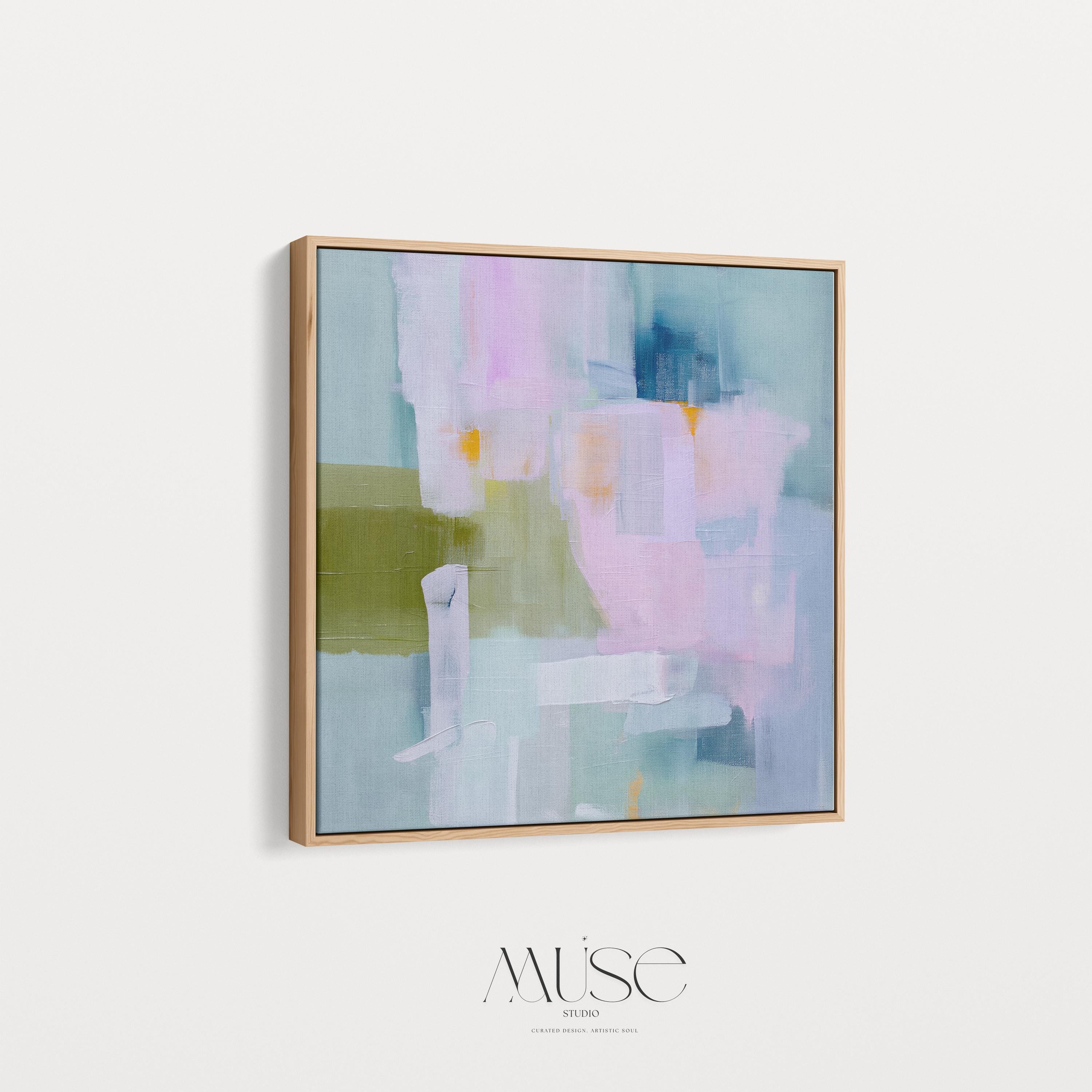 Framed abstract wall art in blush pink, sage green, and soft blue, painted with layered brushstrokes in a muted modern style. Perfect for soft contemporary interiors, dreamy bedrooms, or large living room walls. Displayed in a premium floating wood frame. Available as a framed canvas wall art piece for designer-inspired home decor.