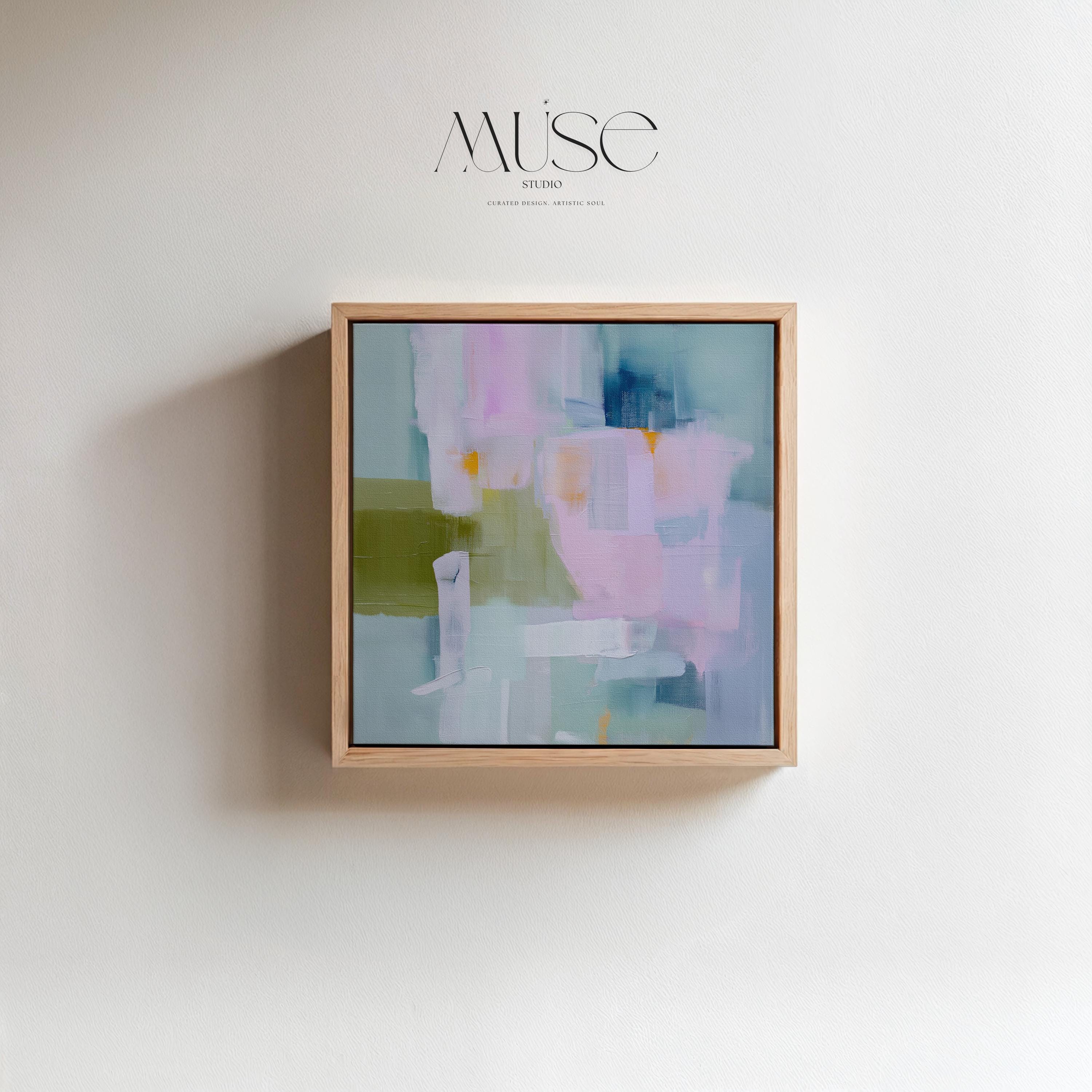 Framed abstract wall art in blush pink, sage green, and soft blue, painted with layered brushstrokes in a muted modern style. Perfect for soft contemporary interiors, dreamy bedrooms, or large living room walls. Displayed in a premium floating wood frame. Available as a framed canvas wall art piece for designer-inspired home decor.