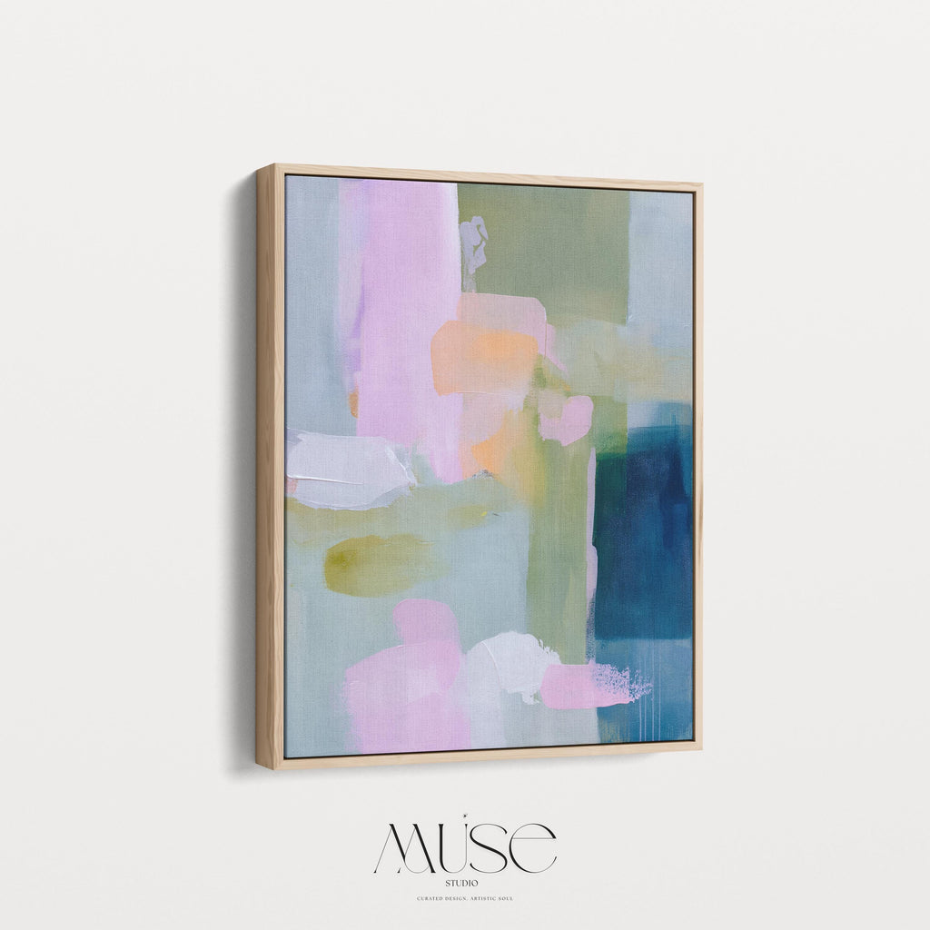 Vertical framed abstract wall art in blush pink, sage green, and coastal blue with layered pastel brushstrokes. A muted modern and soft contemporary design perfect for living rooms, entryways, or bedrooms. Displayed in a premium floating wood frame for a refined finish. Available as XL framed wall art by Muse Studio.