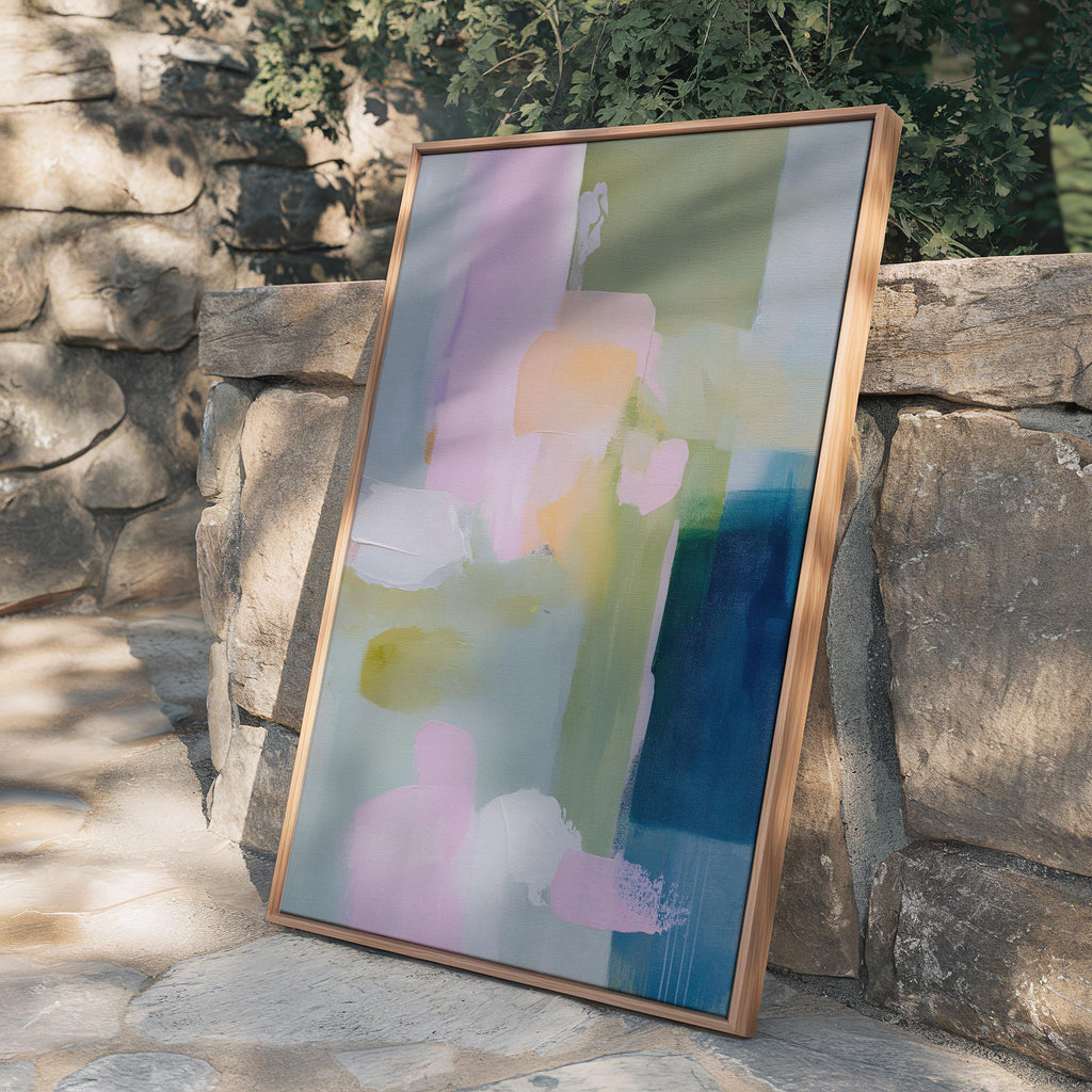 Vertical framed abstract wall art in blush pink, sage green, and coastal blue with layered pastel brushstrokes. A muted modern and soft contemporary design perfect for living rooms, entryways, or bedrooms. Displayed in a premium floating wood frame for a refined finish. Available as XL framed wall art by Muse Studio.