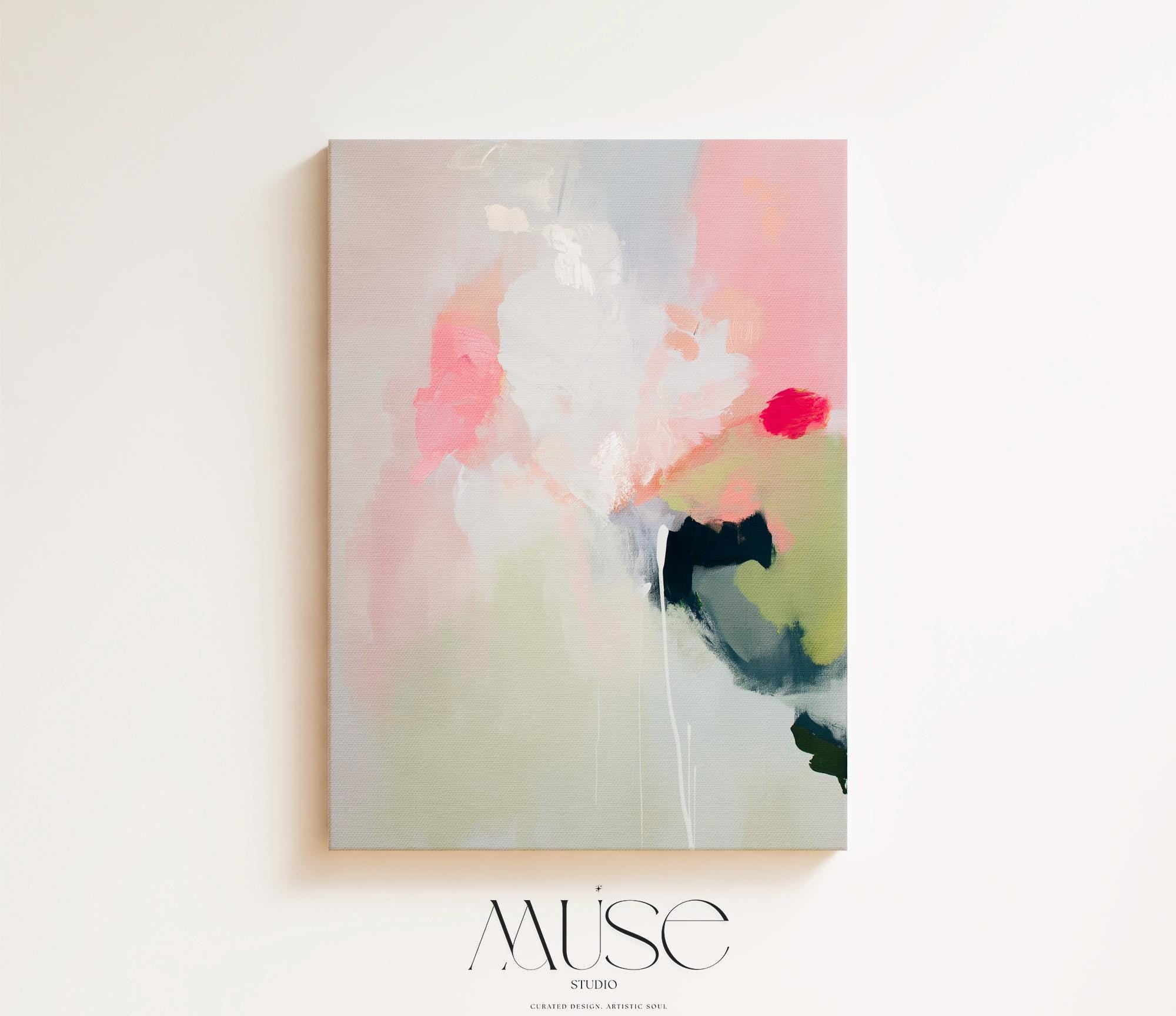 Vertical abstract canvas wall art in blush pink, green, and muted pastel tones with warm minimalist styling. Gentle brushstrokes create a serene, modern look ideal for bedrooms, living rooms, or entryway walls. This calming artwork pairs beautifully with neutral furnishings and layered textures. Available as a gallery-wrapped canvas, framed canvas, or fine art poster print for curated boutique home decor.