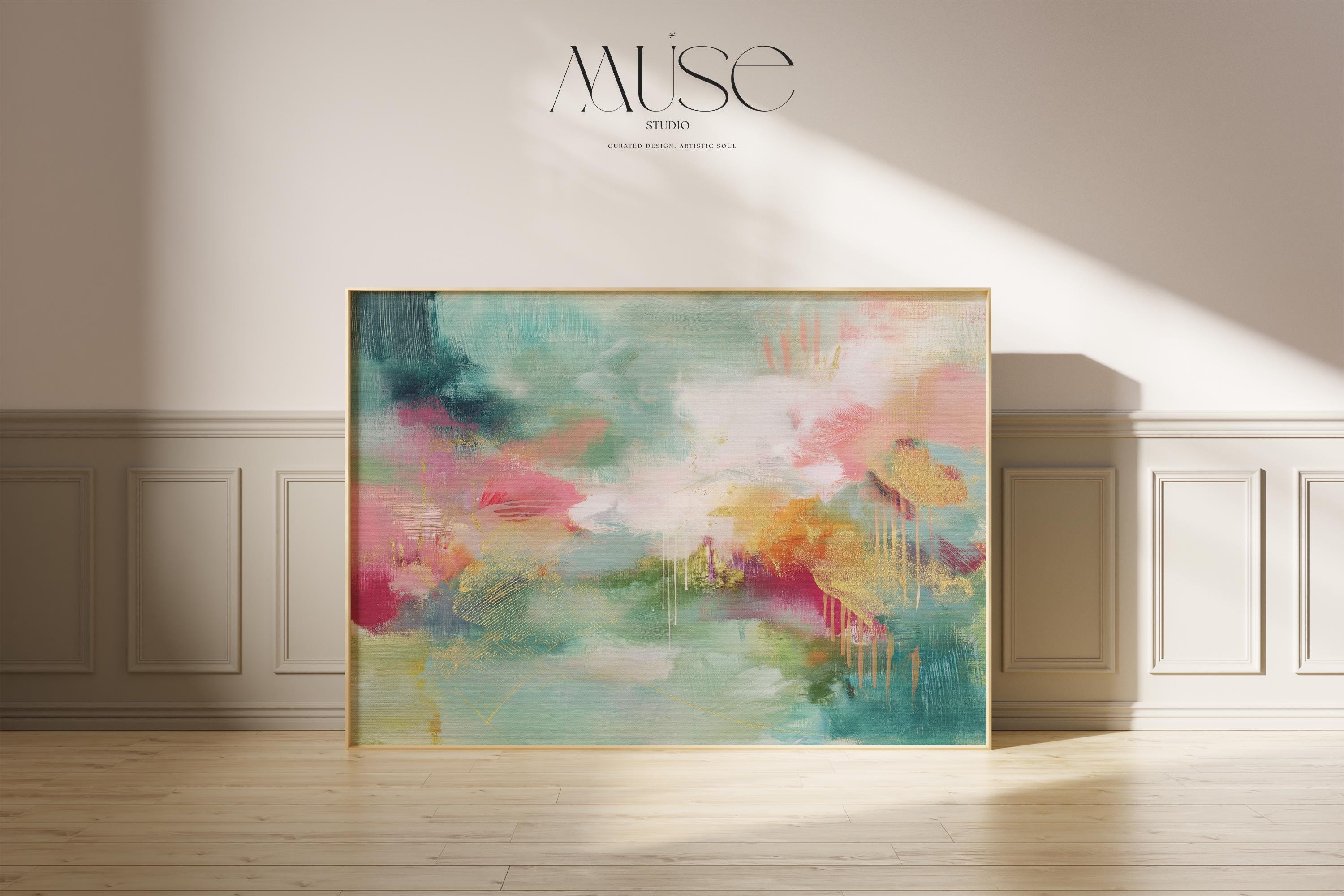 Horizontal abstract canvas wall art with bold teal, soft coral, and golden accents, framed in a warm neutral room. Designed with expressive brushstrokes and rich color layering, this extra-large piece brings eclectic and transitional style to living rooms, dining spaces, or modern interiors. Available as framed or gallery-wrapped canvas from Muse Studio.