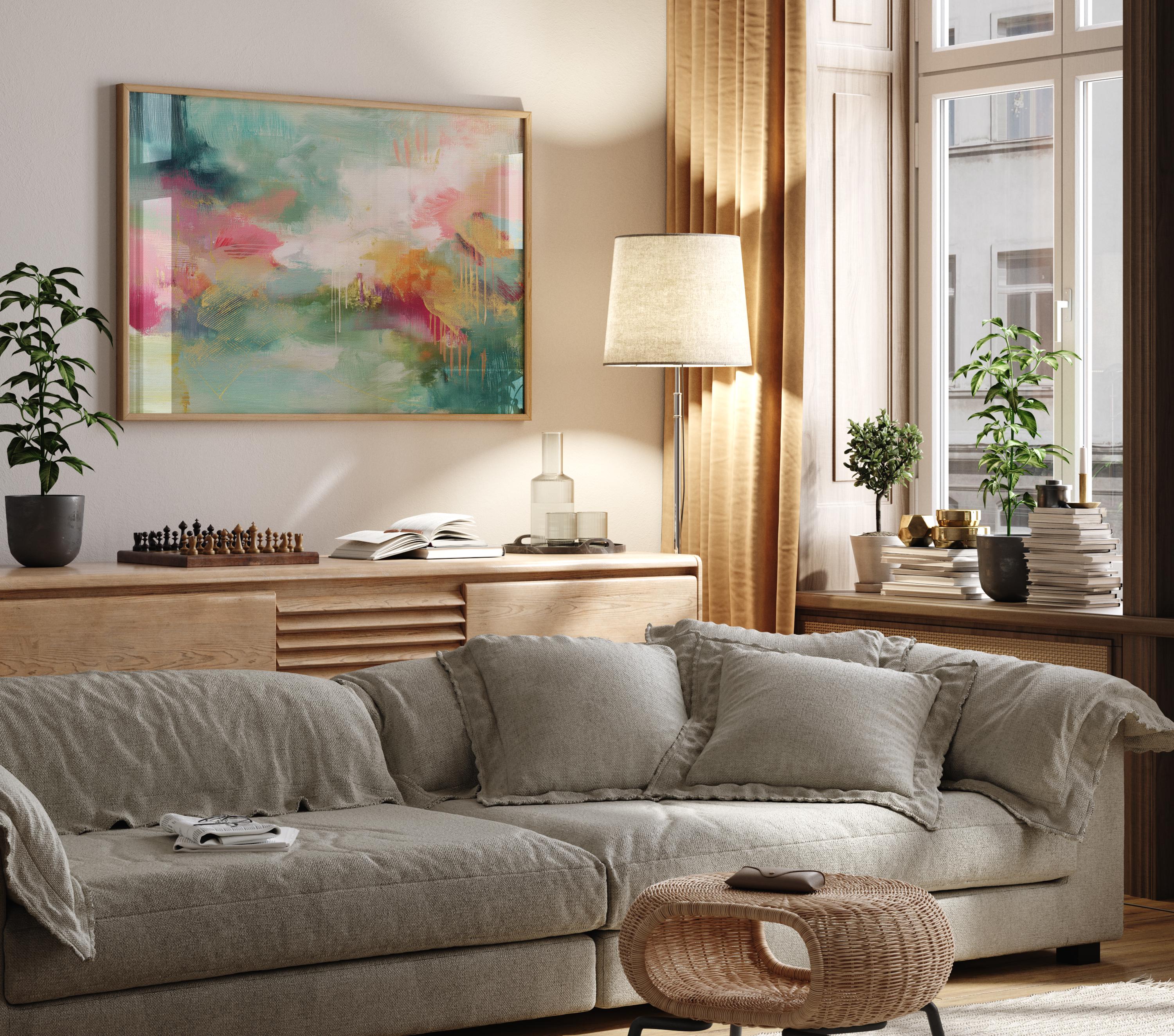 Horizontal abstract canvas wall art with bold teal, soft coral, and golden accents, framed in a warm neutral room. Designed with expressive brushstrokes and rich color layering, this extra-large piece brings eclectic and transitional style to living rooms, dining spaces, or modern interiors. Available as framed or gallery-wrapped canvas from Muse Studio.