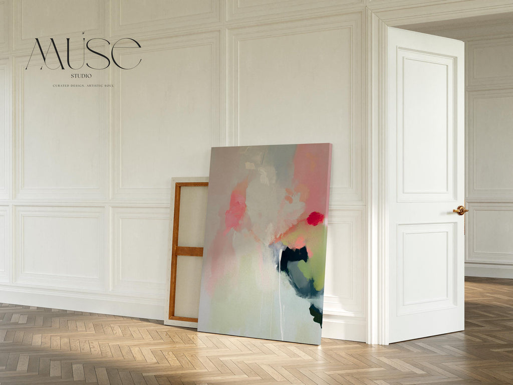 Vertical abstract canvas wall art in blush pink, green, and muted pastel tones with warm minimalist styling. Gentle brushstrokes create a serene, modern look ideal for bedrooms, living rooms, or entryway walls. This calming artwork pairs beautifully with neutral furnishings and layered textures. Available as a gallery-wrapped canvas, framed canvas, or fine art poster print for curated boutique home decor.