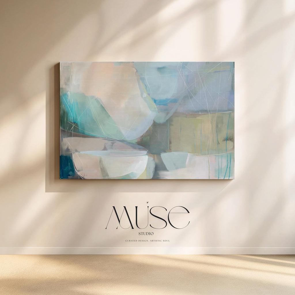 Horizontal abstract wall art in soft blue, aqua, and muted neutral tones displayed on a sunlit wall. Large modern canvas painting with pastel contemporary brushwork, ideal for living room, bedroom, or designer interior spaces. Available as a large canvas wall art print by Muse Studio.