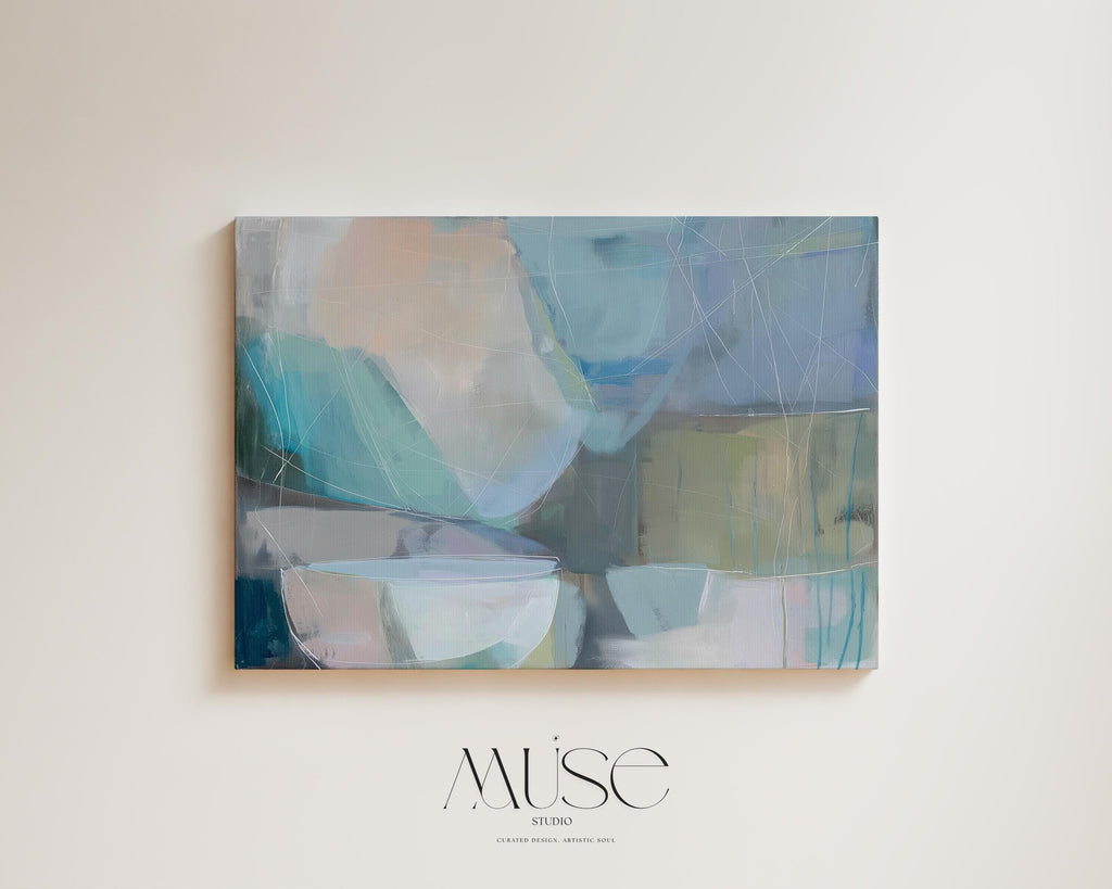 Horizontal abstract wall art in soft blue, aqua, and muted neutral tones displayed on a sunlit wall. Large modern canvas painting with pastel contemporary brushwork, ideal for living room, bedroom, or designer interior spaces. Available as a large canvas wall art print by Muse Studio.