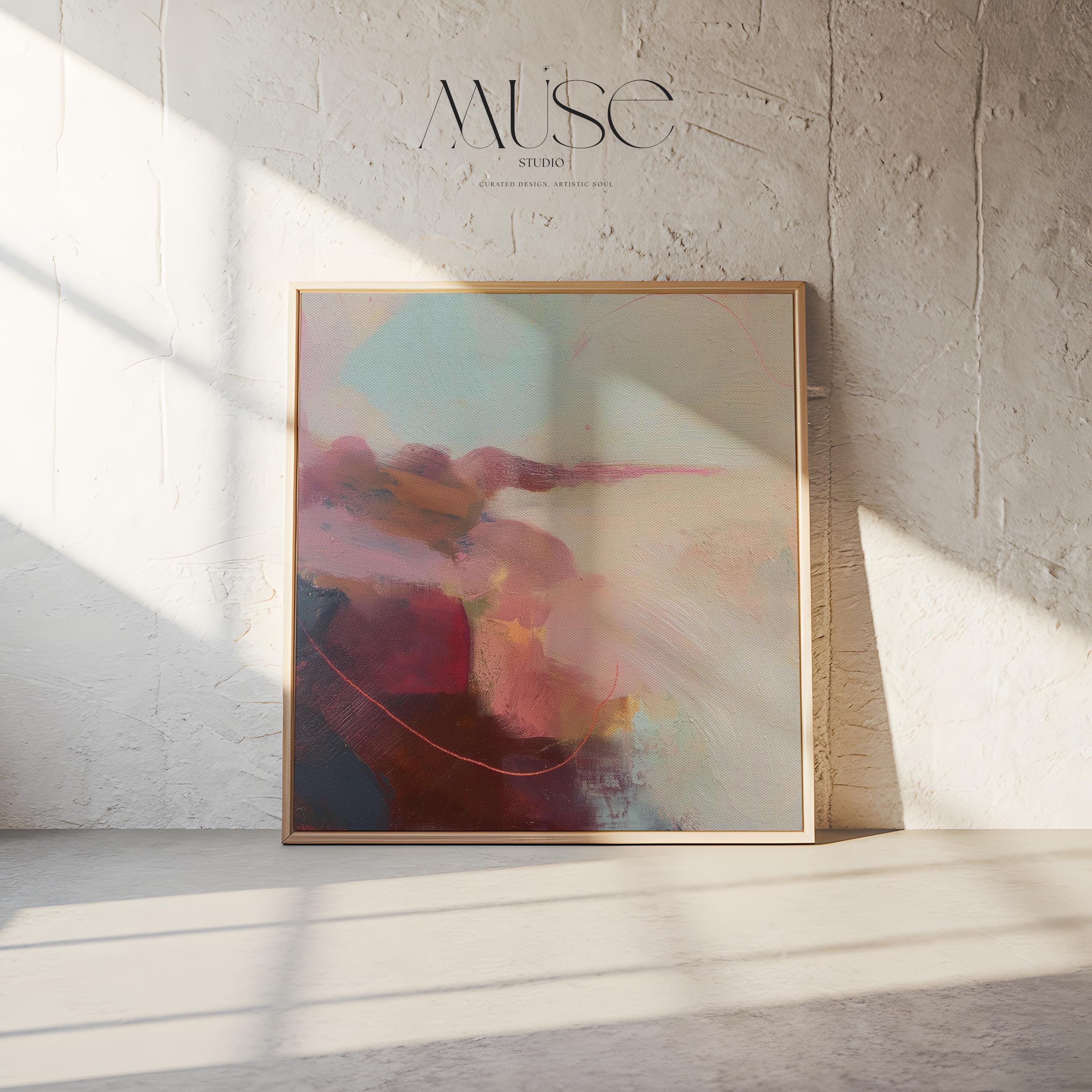 Large square abstract wall art in blush, burgundy, peach, and soft teal tones displayed above a modern black credenza with an Eames lounge chair in a light, elegant room. Warm contemporary abstract canvas for living room or designer interiors, available as framed wall art or canvas by Muse Studio.
