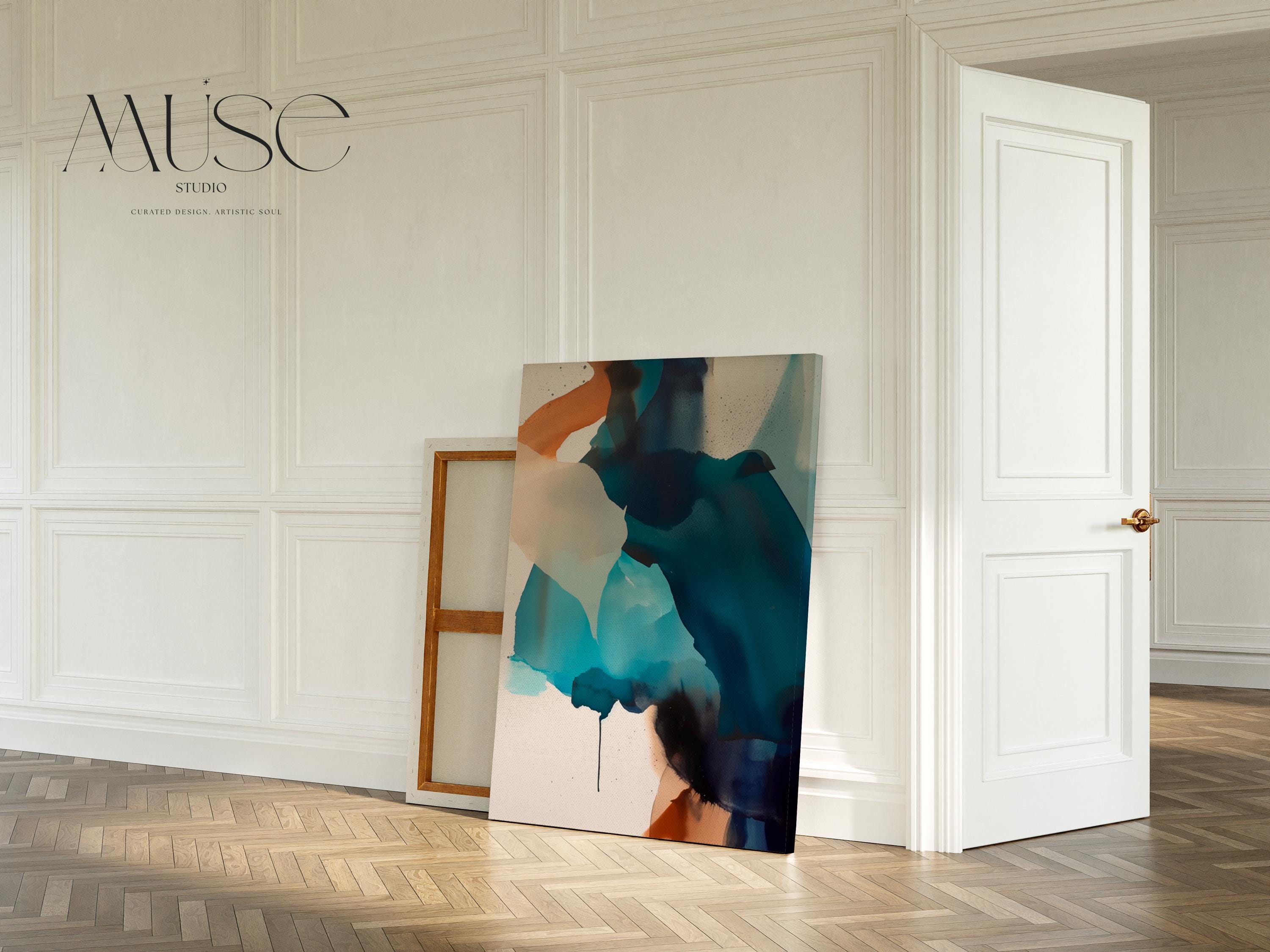 Vertical gallery-wrapped canvas featuring an abstract composition of teal, deep navy, soft aqua, and sand with fluid, ink-like motion across a neutral base. This nature-inspired wall art adds a tranquil, contemporary presence to coastal interiors, entryways, or stairwells. A soft modern statement piece, available as canvas or floating framed wall art from Muse Studio.