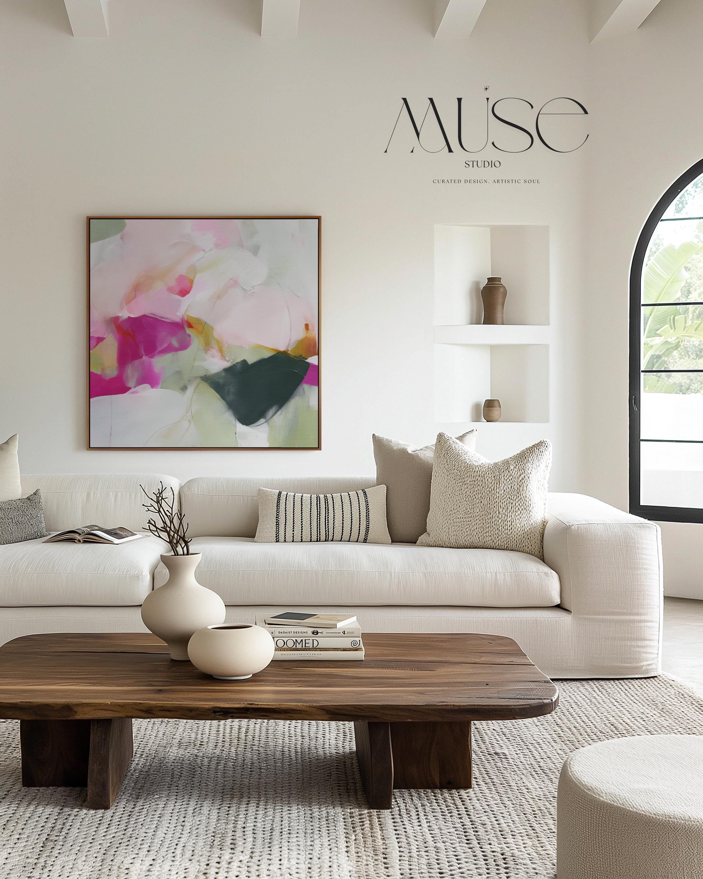 Muse Studio framed floral wall art featuring a pink and green minimalist abstract composition with blush, cream, sage, soft white, and deep charcoal tones. Square framed canvas artwork with romantic botanical movement, museum-grade giclée inks, premium cotton canvas, and custom wood float frame options, styled for living room, bedroom, office, dining room, or soft contemporary interiors.