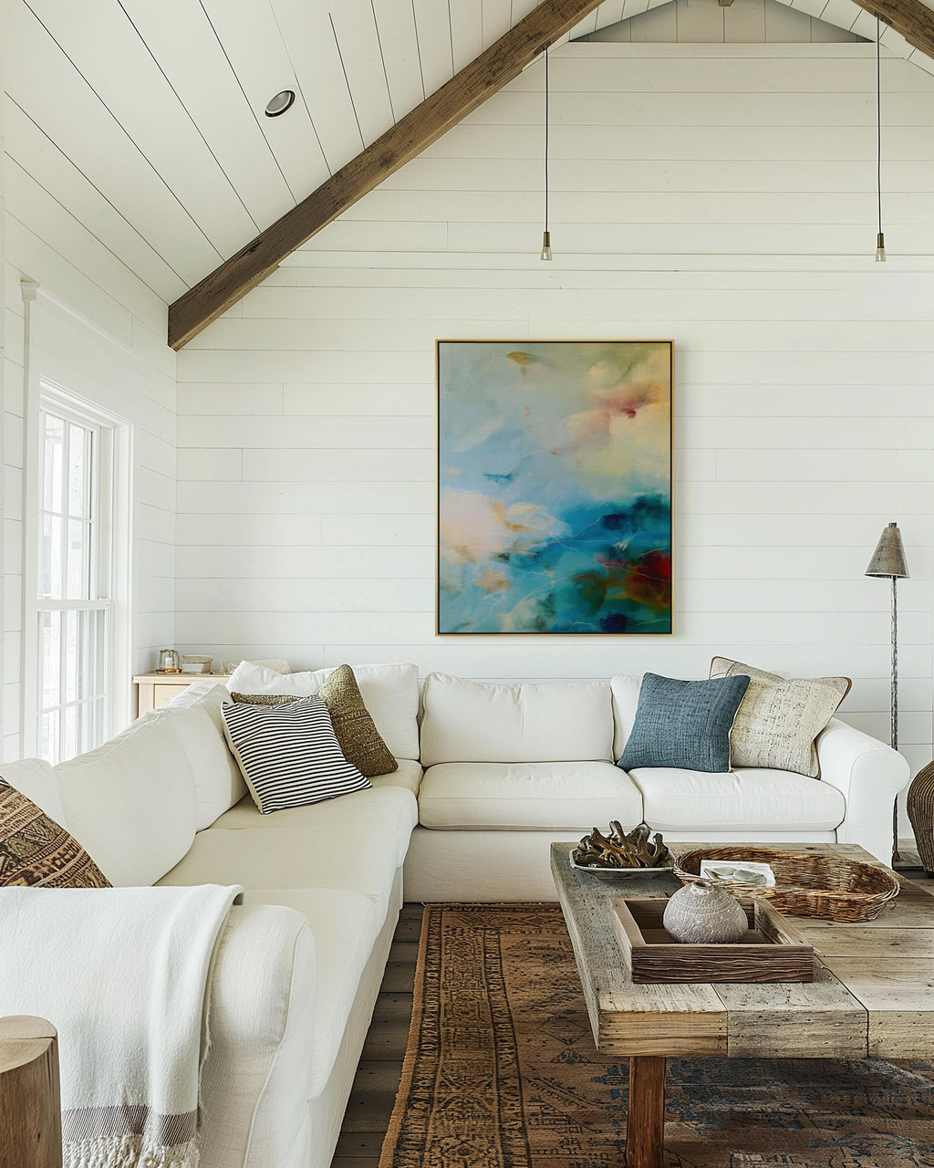 Vertical canvas wall art featuring an abstract blend of teal, cream, ocean blue, and earthy green. This soft color composition evokes the serenity of coastal skies and natural light. Ideal for tranquil interiors such as a spa, entryway, or bedroom retreat, this piece suits warm minimalist and nature-inspired decor styles. Available as a gallery-wrapped stretched canvas, framed canvas, or fine art print. Original artwork by Muse Studio.