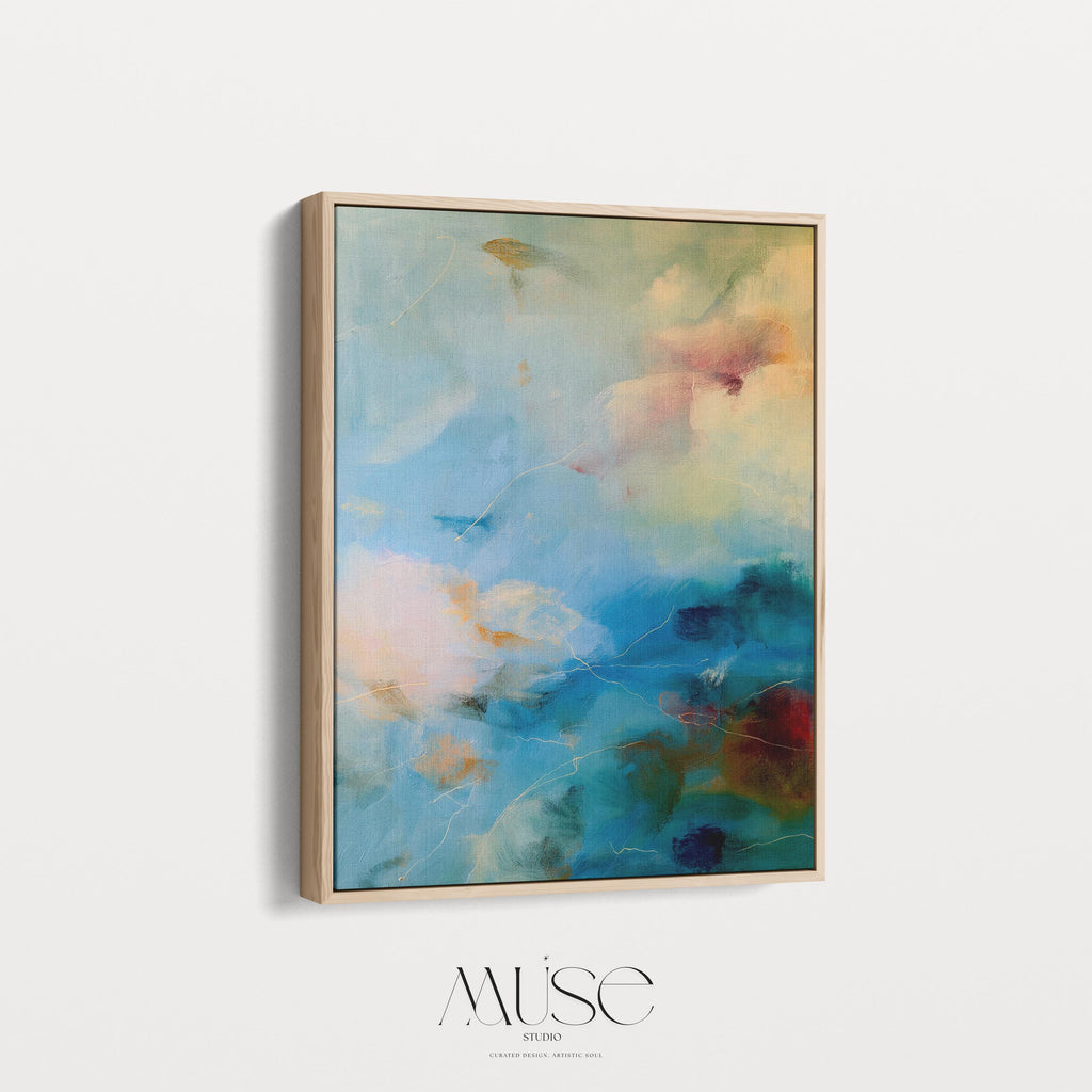 Vertical canvas wall art featuring an abstract blend of teal, cream, ocean blue, and earthy green. This soft color composition evokes the serenity of coastal skies and natural light. Ideal for tranquil interiors such as a spa, entryway, or bedroom retreat, this piece suits warm minimalist and nature-inspired decor styles. Available as a gallery-wrapped stretched canvas, framed canvas, or fine art print. Original artwork by Muse Studio.