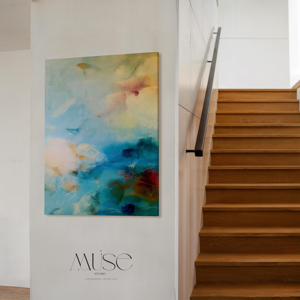 Vertical teal blue and cream abstract wall art with soft, nature-inspired movement. This large canvas design evokes a coastal calm ideal for spa interiors, serene entryways, or modern organic spaces. Available as gallery-wrapped or framed wall art by Muse Studio.