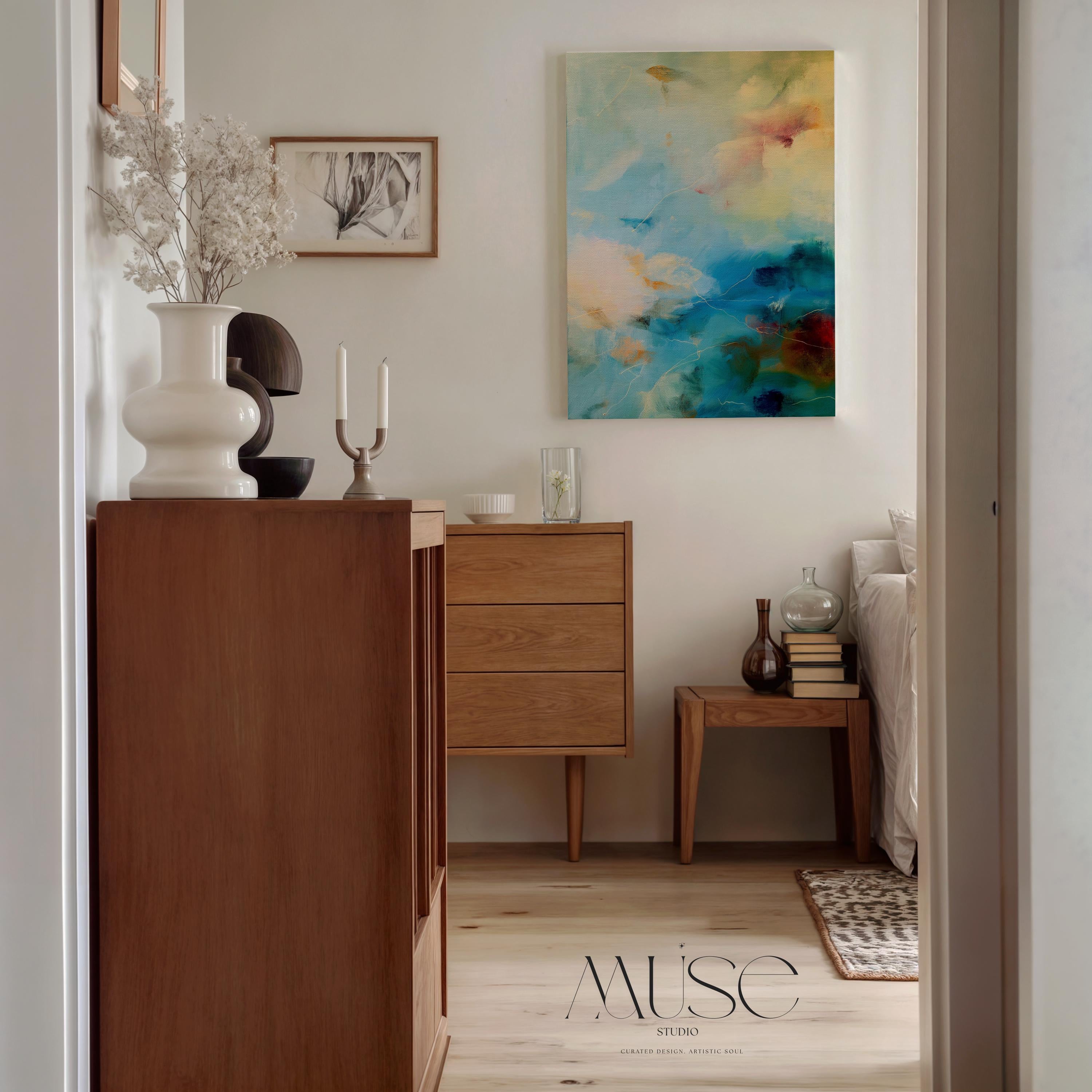 Vertical canvas wall art featuring an abstract design in teal blue, pale cream, soft blush, and warm ochre with hints of plum. This tranquil composition evokes the soothing energy of coastal skies and ocean mist. Perfect for a spa bathroom, entryway, or serene retreat. Complements nature-inspired, warm minimalist, or coastal interiors. Available as a gallery-wrapped stretched canvas, framed canvas, or fine art poster print. Original artwork by Muse Studio.