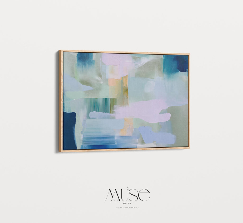 Framed horizontal abstract wall art in coastal blue, sage green, and blush pink, painted with soft layered brushstrokes. A muted modern piece that fits perfectly above sofas, beds, or long entryway walls. Premium floating wood frame for a polished finish. Available as large framed canvas wall art by Muse Studio.