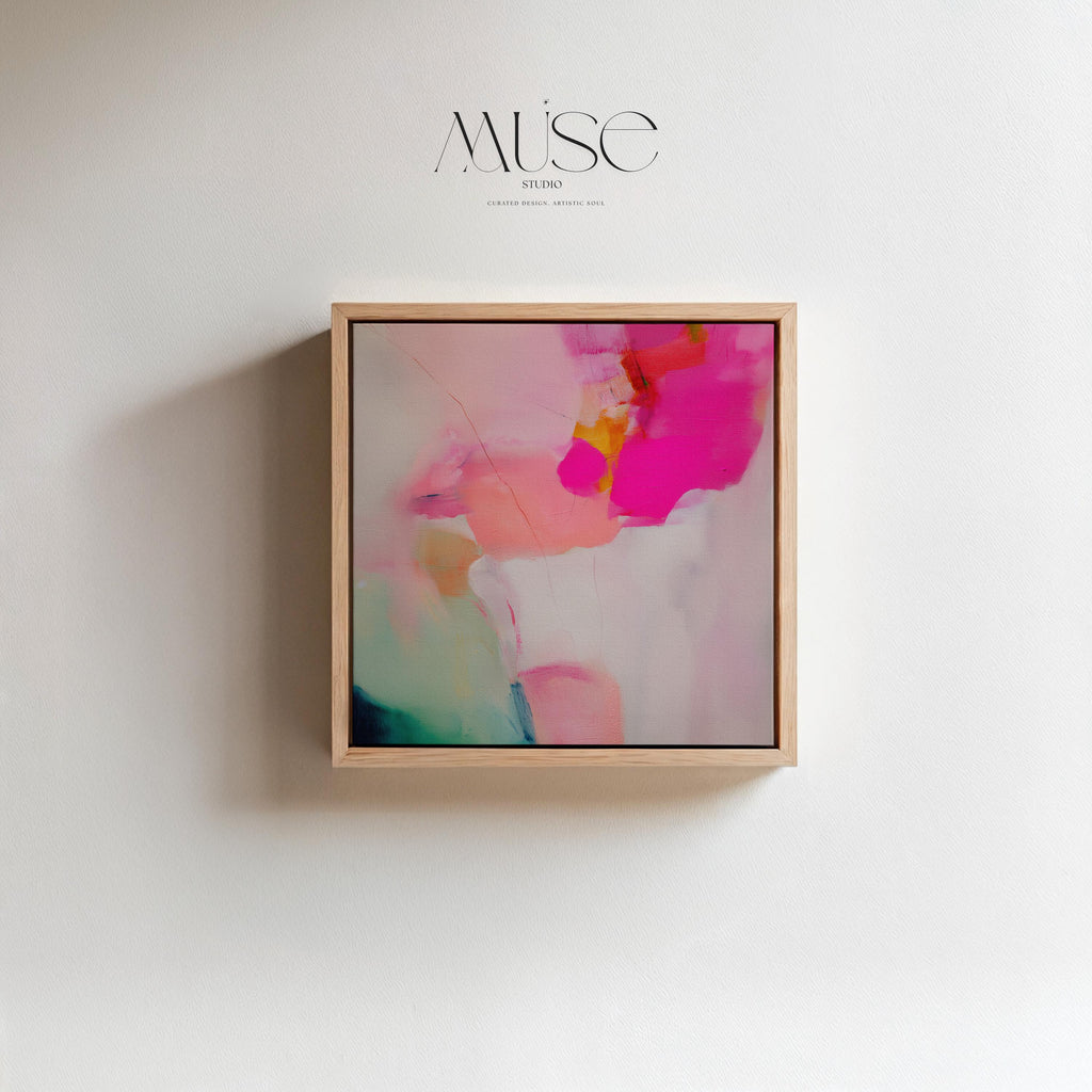 Framed canvas wall art featuring bold fuchsia pink, blush, coral, and aqua teal tones in a square abstract giclée print. Designed as a statement piece for dining rooms, living rooms, or bedrooms, this artwork blends transitional and contemporary boho style with vibrant sophistication. Available as a floating framed canvas giclée print in multiple sizes, perfect for curated designer-inspired home decor.