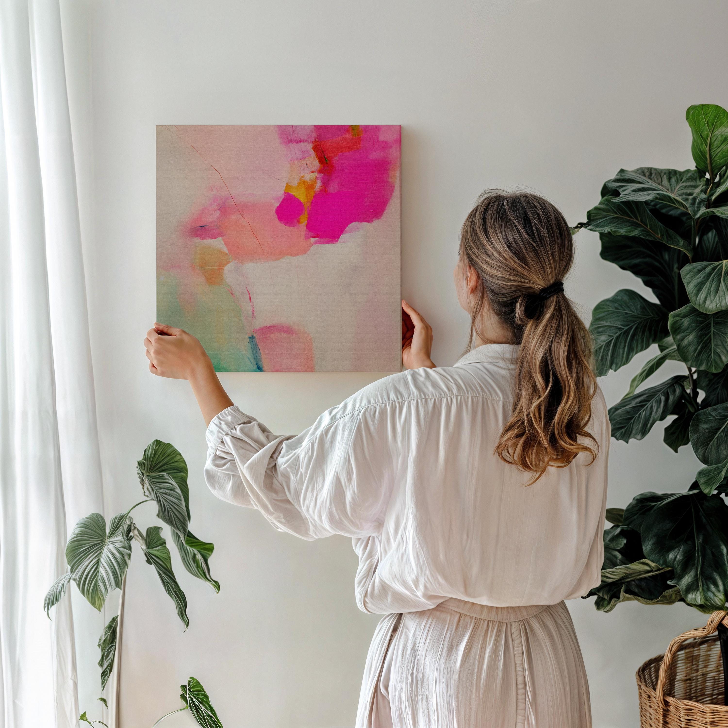 Abstract large canvas wall art featuring pastel botanical tones of fuchsia pink, blush, and aqua teal. Designed as a giclée print in a square format, this piece blends pastel softness with boho decor charm. Perfect for living rooms, dining rooms, or bedrooms, it creates a vibrant yet calming focal point. Offered as a gallery-wrapped large canvas wall art giclée print in multiple sizes for curated modern interiors.