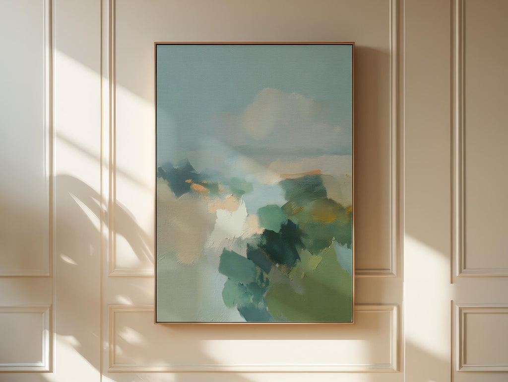 Vertical abstract wall art in teal blue and sage green with soft, misty brushstrokes inspired by nature. Large calming canvas artwork designed for living rooms, bedrooms, and entryways, styled for soft contemporary and coastal interiors. Available as a gallery-wrapped canvas, framed canvas, or fine art print.