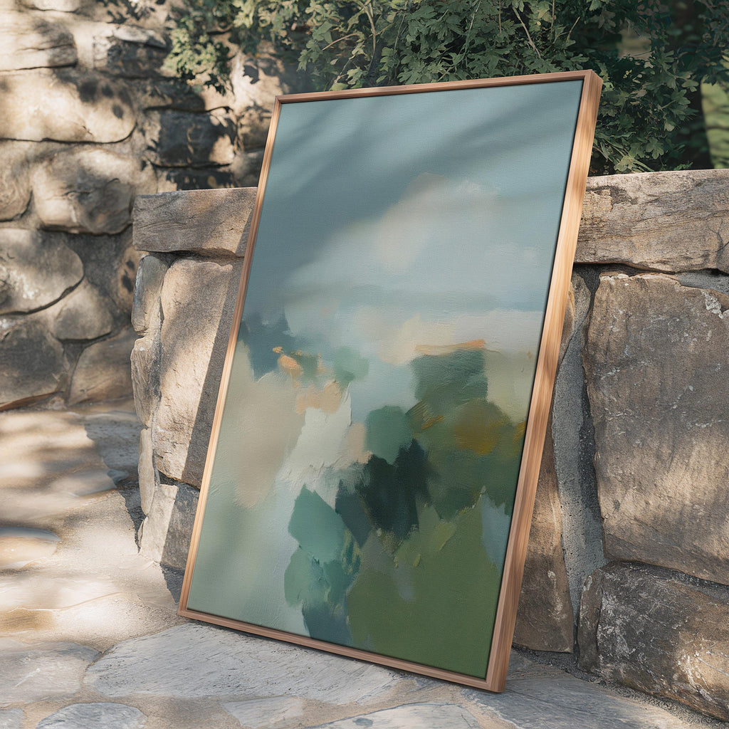 Vertical abstract wall art in teal blue and sage green with soft, misty brushstrokes inspired by nature. Large calming canvas artwork designed for living rooms, bedrooms, and entryways, styled for soft contemporary and coastal interiors. Available as a gallery-wrapped canvas, framed canvas, or fine art print.