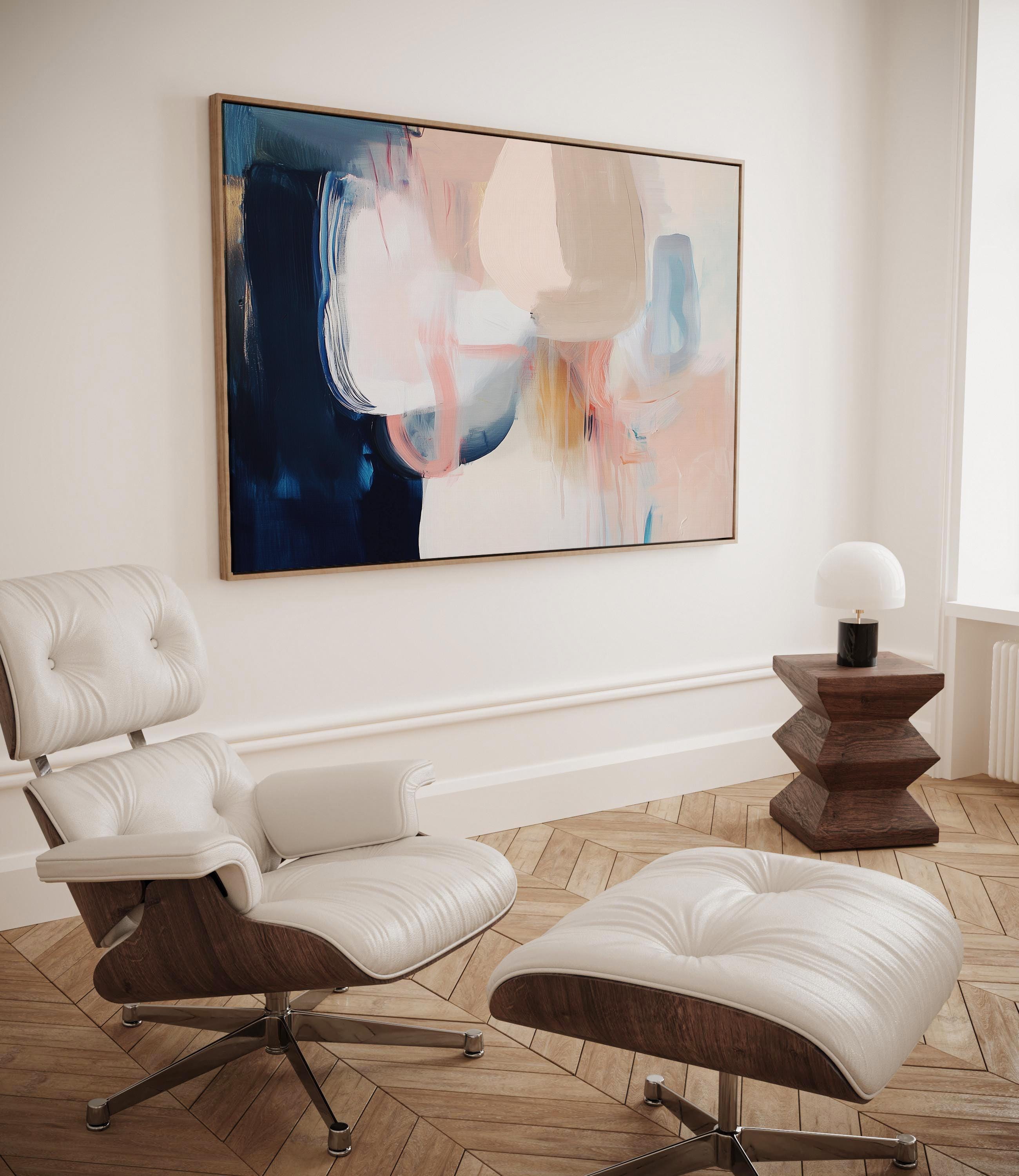 Large framed canvas wall art featuring blush, peach, ivory, muted blue, and navy tones in a horizontal abstract giclée print. Designed in muted neutral style with transitional and soft contemporary appeal, this artwork is perfect for living rooms, dining rooms, or bedrooms. Its calming palette and painterly textures bring balance and elegance to interiors. Available as a floating framed canvas giclée print in multiple large sizes.