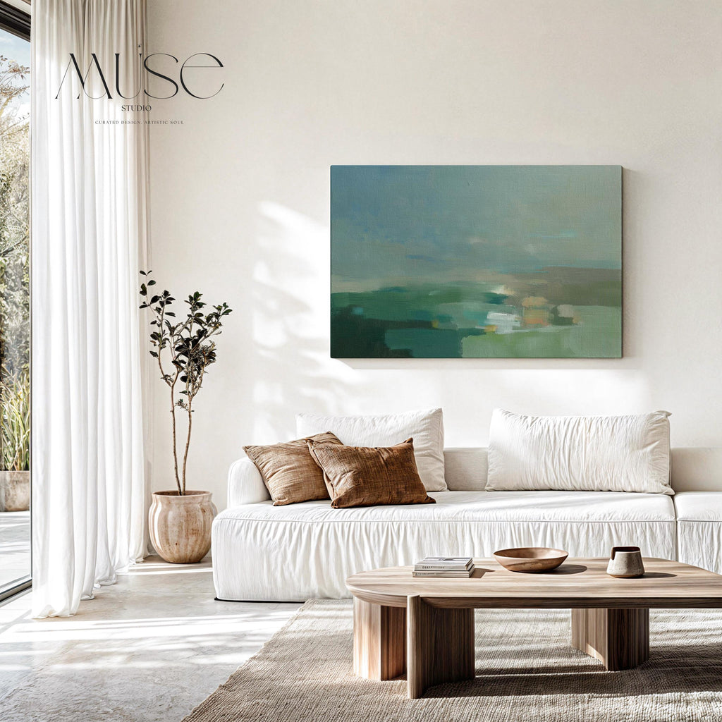Horizontal abstract wall art in sage green, teal, and muted earth tones with soft blended brushstrokes that resemble a peaceful horizon. Large calming artwork designed for minimalist, nature-inspired, and coastal interiors. Perfect for living rooms, bedrooms, or entryways seeking serene modern decor. Available as gallery-wrapped canvas, framed canvas, or fine art print for versatile styling.