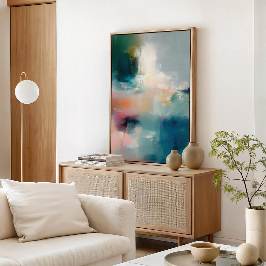 Vertical abstract canvas wall art featuring teal, coral, blush, and warm tones blended in painterly textures. Contemporary large artwork framed in wood, perfect for living room, bedroom, or office statement decor. Designed to suit transitional, modern, and soft contemporary interiors. Available as canvas wall art, framed canvas, or fine art print.