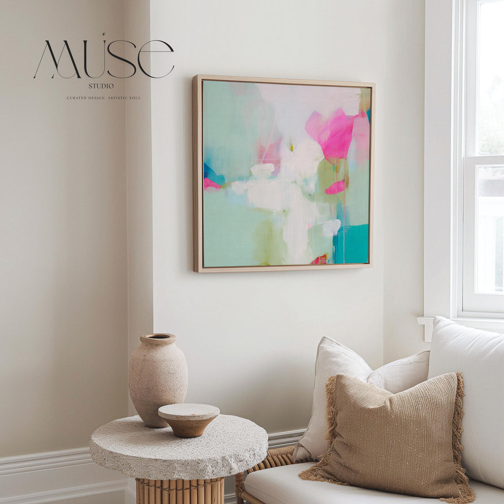 Square abstract canvas wall art featuring aqua blue, blush pink, and soft white brushstrokes in a light, painterly style. Designed for soft contemporary and preppy interiors, this large framed artwork brings an airy, uplifting mood to bedrooms, nurseries, or living rooms. Available as a gallery-wrapped or framed canvas for curated designer decor.