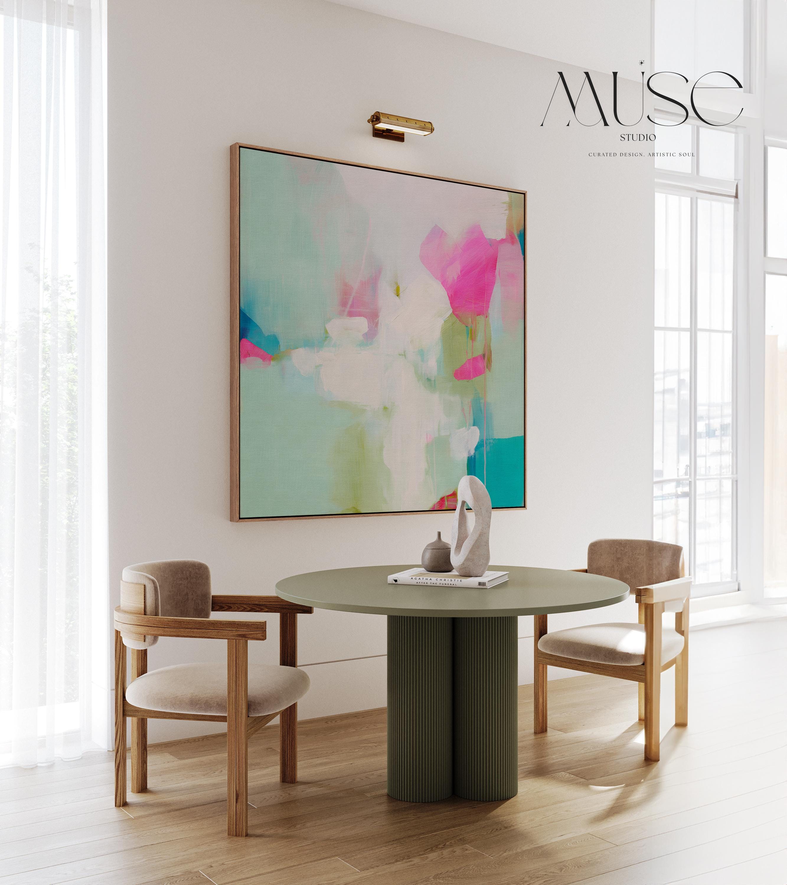 Square abstract canvas wall art featuring aqua blue, blush pink, and soft white brushstrokes in a light, painterly style. Designed for soft contemporary and preppy interiors, this large framed artwork brings an airy, uplifting mood to bedrooms, nurseries, or living rooms. Available as a gallery-wrapped or framed canvas for curated designer decor.