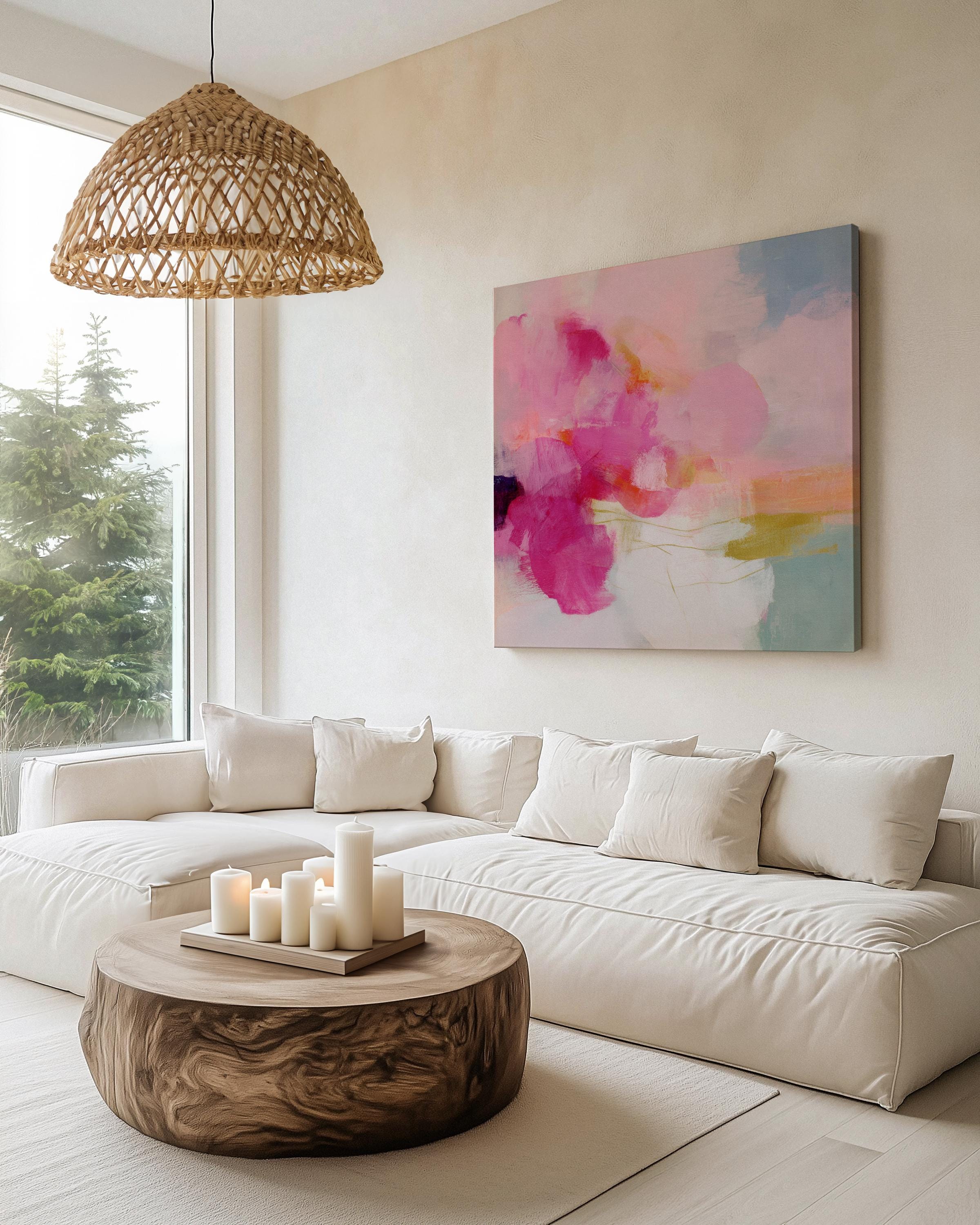 Square abstract canvas wall art featuring vivid pink, coral, and golden brushstrokes against a soft backdrop. Bold yet refined, this statement artwork suits transitional, boho, and soft contemporary interiors. Perfect for bedrooms, living rooms, or entryway decor. Available as framed or gallery-wrapped canvas.