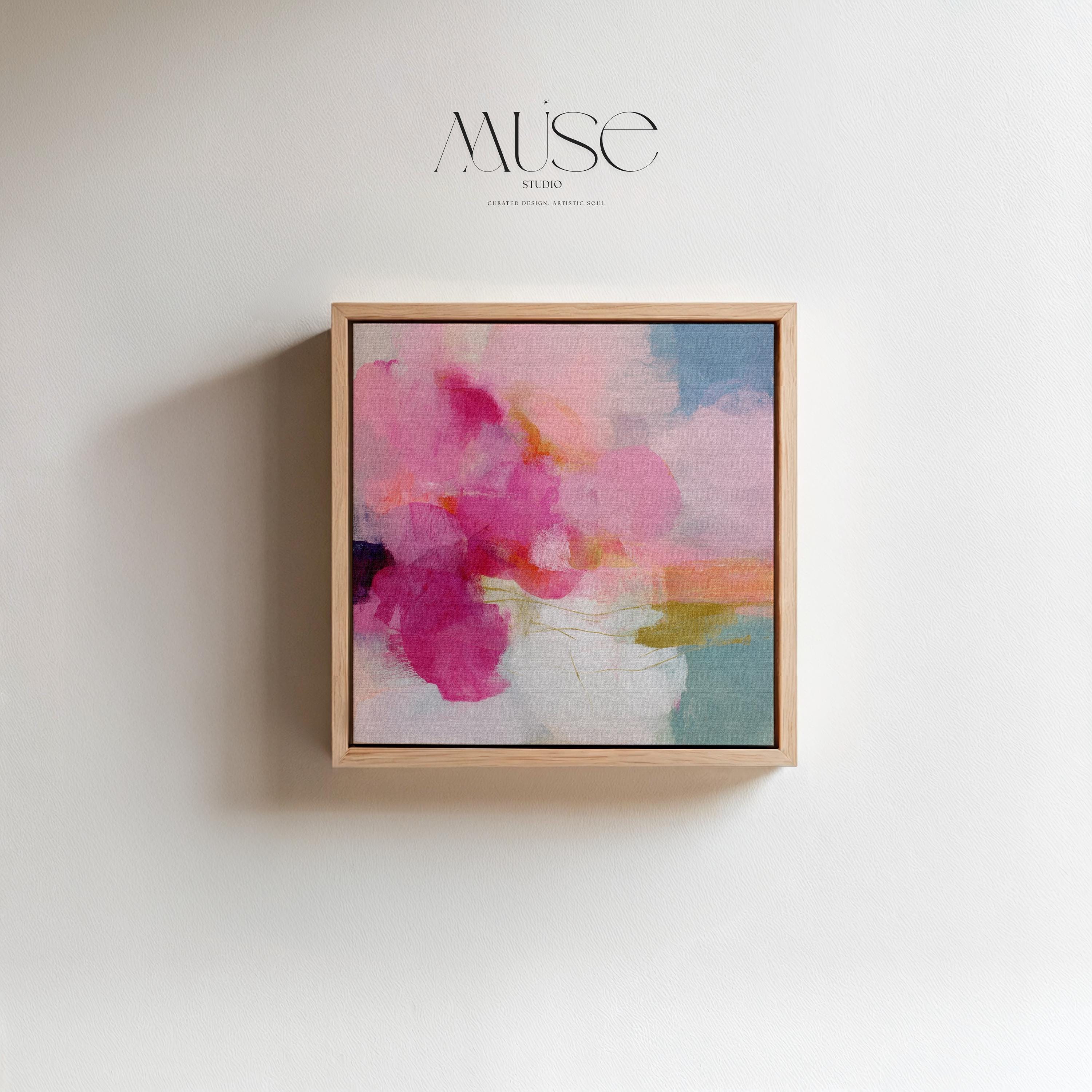 Framed square canvas wall art featuring bold pink and coral brushstrokes with teal and golden undertones. This abstract artwork blends boho, transitional, and soft contemporary design, perfect for bedrooms, living rooms, or entryway decor. Available as framed or gallery-wrapped canvas.