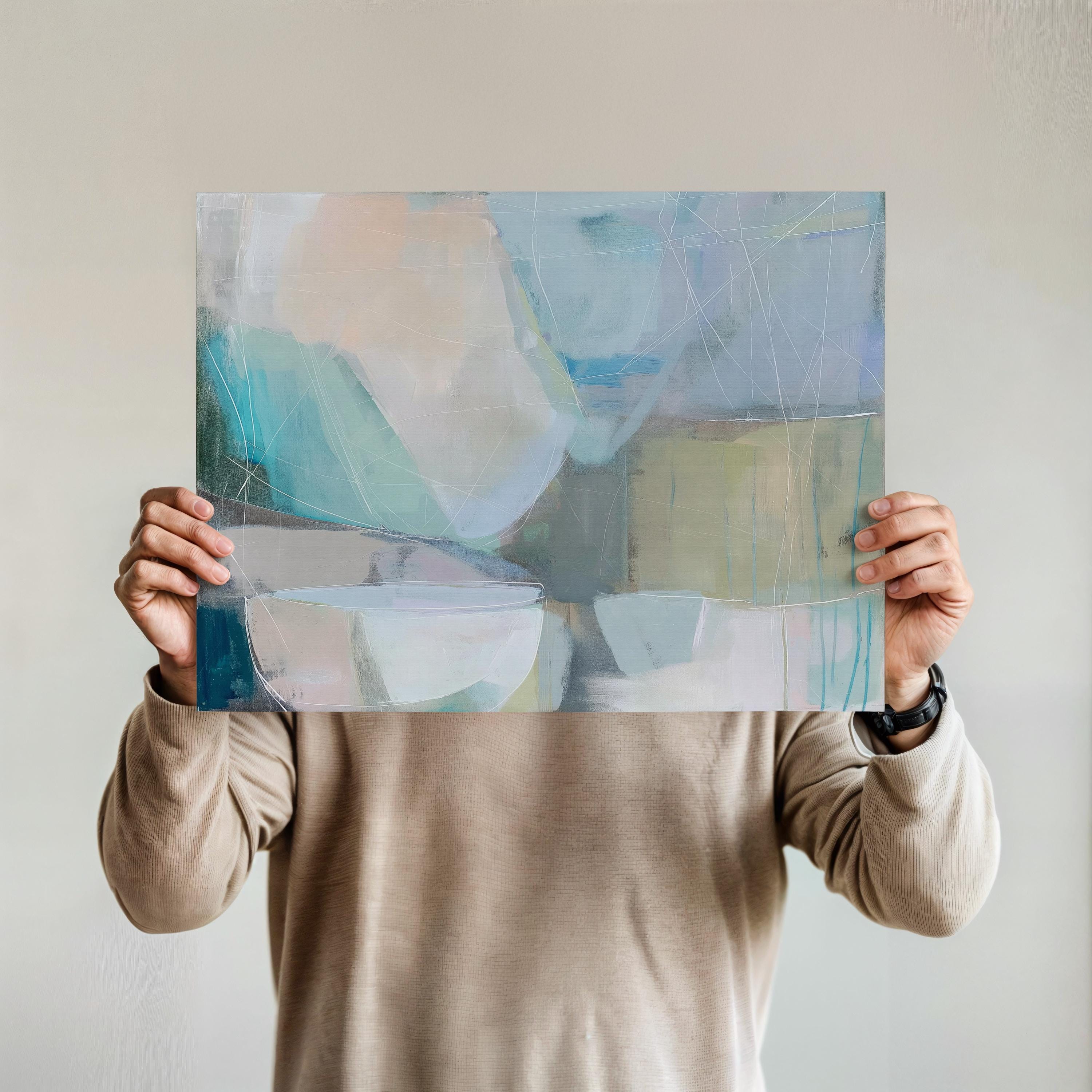 Horizontal abstract wall art in soft blue, aqua, and muted neutral tones displayed on a sunlit wall. Large modern canvas painting with pastel contemporary brushwork, ideal for living room, bedroom, or designer interior spaces. Available as a large canvas wall art print by Muse Studio.
