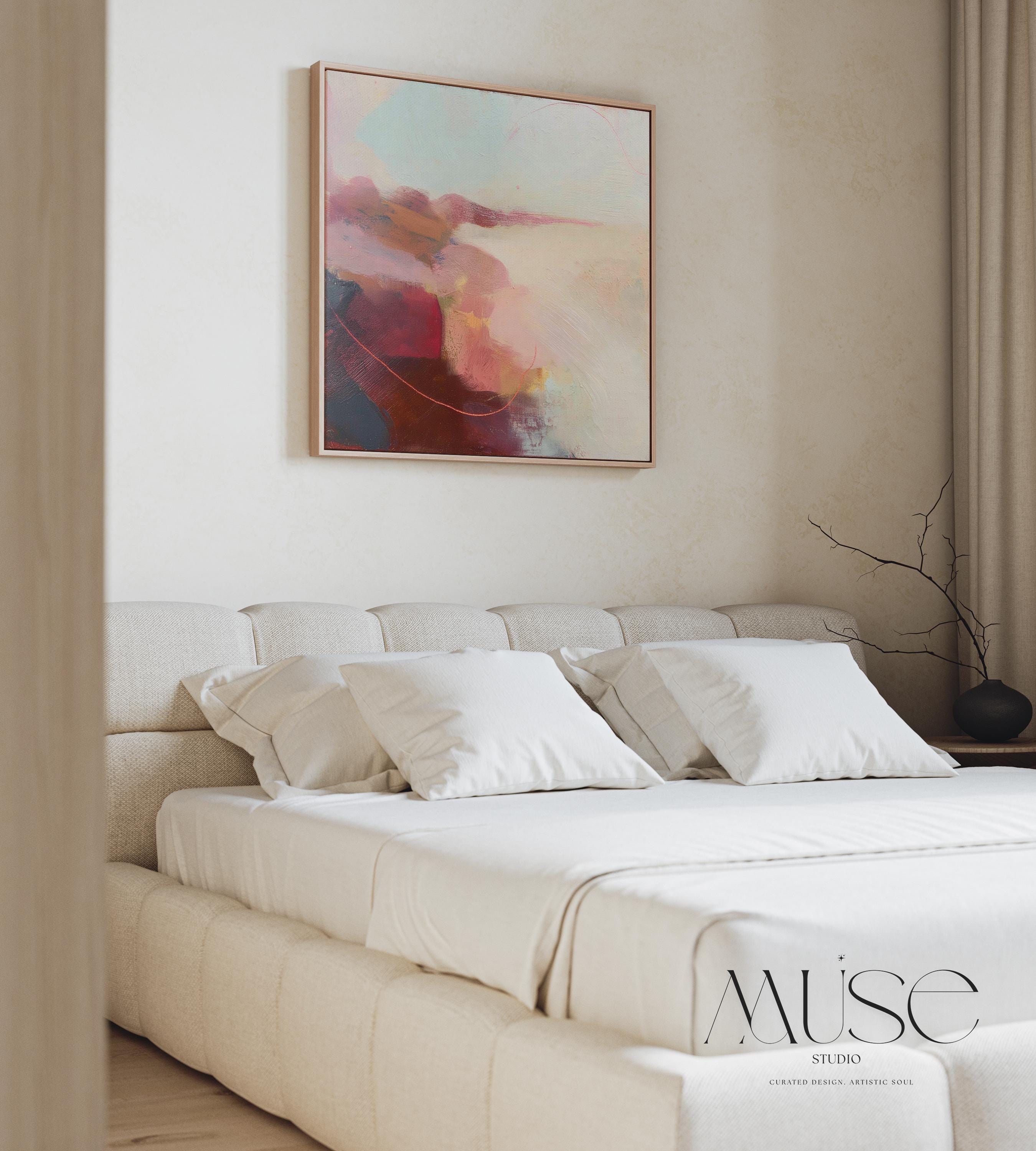 Large square abstract wall art in blush, burgundy, peach, and soft teal tones displayed above a modern black credenza with an Eames lounge chair in a light, elegant room. Warm contemporary abstract canvas for living room or designer interiors, available as framed wall art or canvas by Muse Studio.