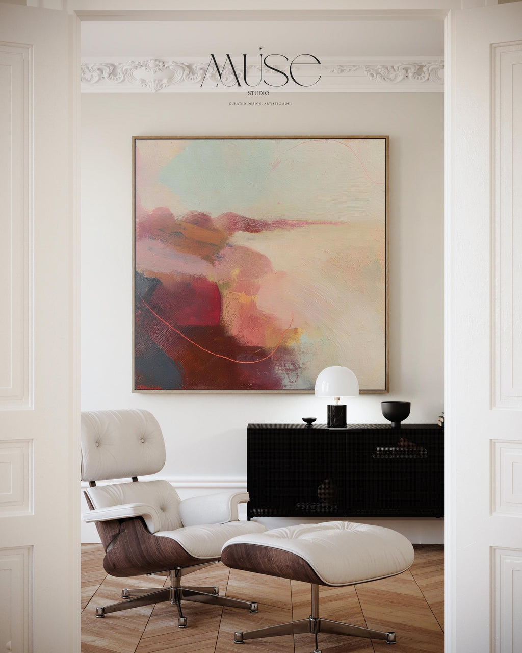Large square abstract wall art in blush, burgundy, peach, and soft teal tones displayed above a modern black credenza with an Eames lounge chair in a light, elegant room. Warm contemporary abstract canvas for living room or designer interiors, available as framed wall art or canvas by Muse Studio.
