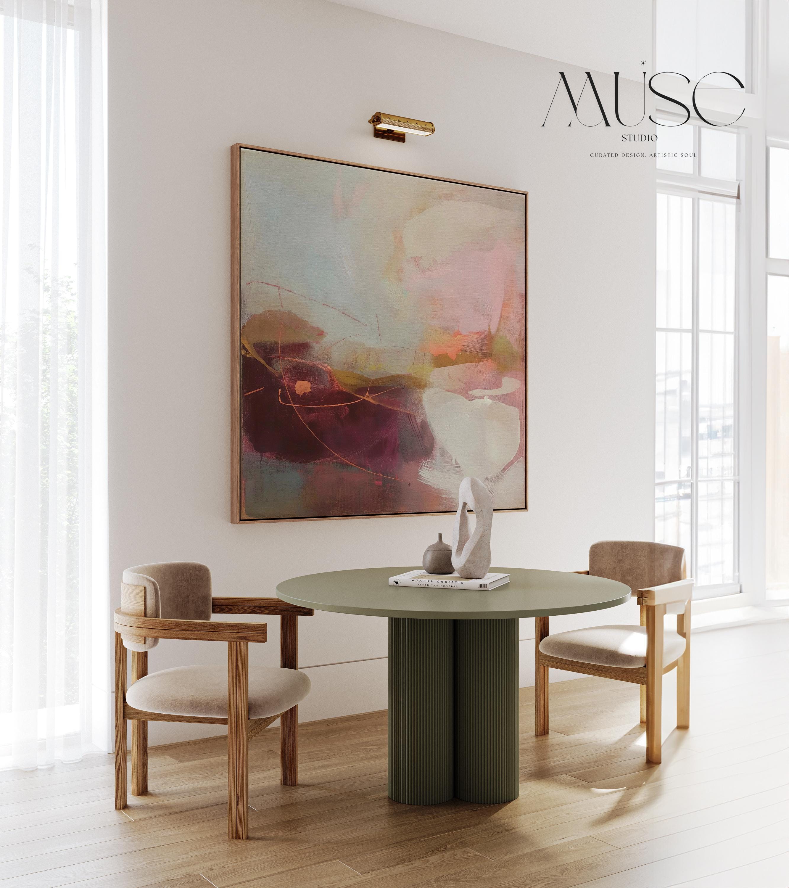 Square framed canvas wall art featuring plum, blush, and warm sand tones with expressive abstract strokes and fluid linework. Inspired by nature and styled for warm minimal interiors, this piece is perfect for dining rooms, entryways, or serene contemporary spaces. Fine art giclée by Muse Studio, available as a floating framed canvas or unframed option.