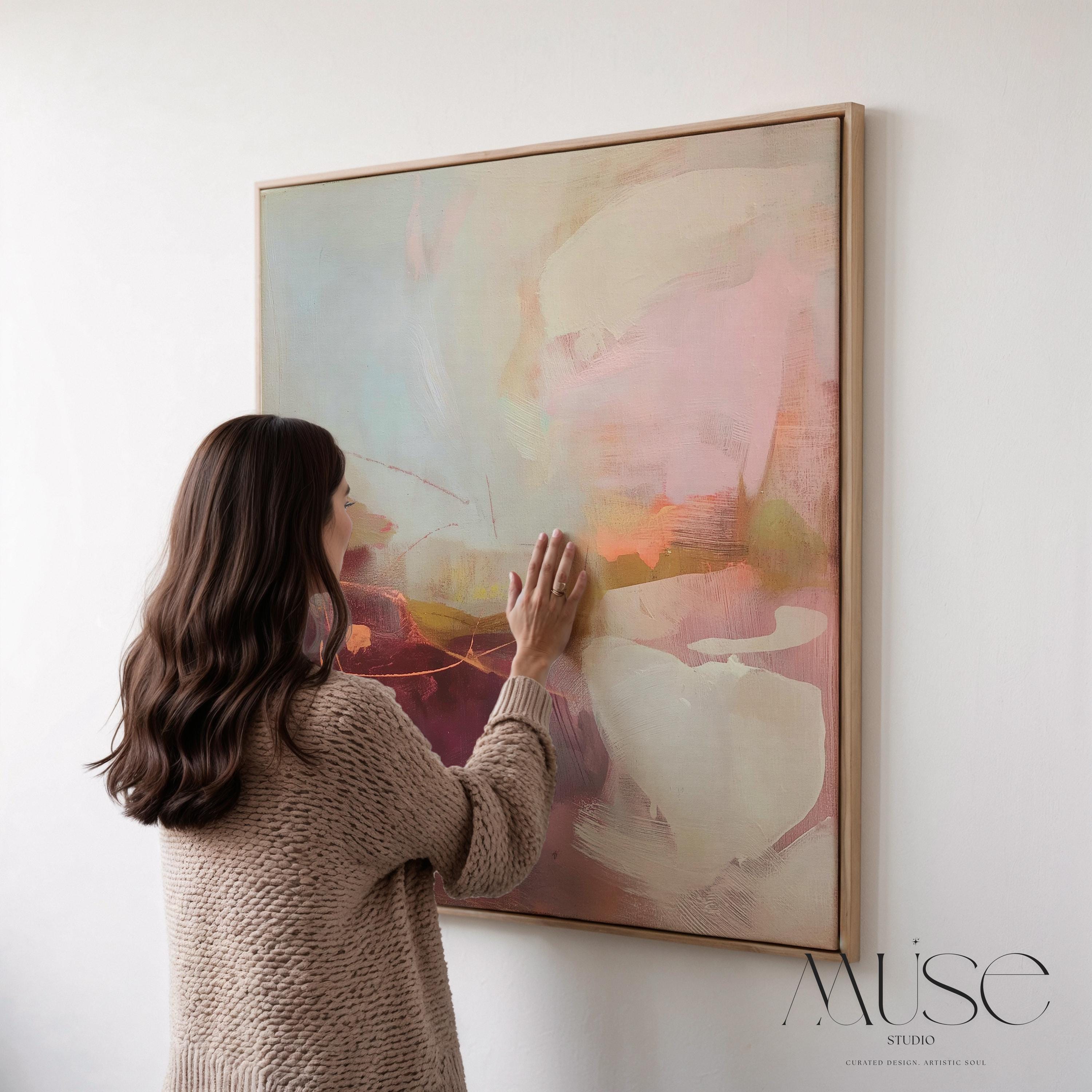 Square framed canvas wall art featuring plum, blush, and warm sand tones with expressive abstract strokes and fluid linework. Inspired by nature and styled for warm minimal interiors, this piece is perfect for dining rooms, entryways, or serene contemporary spaces. Fine art giclée by Muse Studio, available as a floating framed canvas or unframed option.