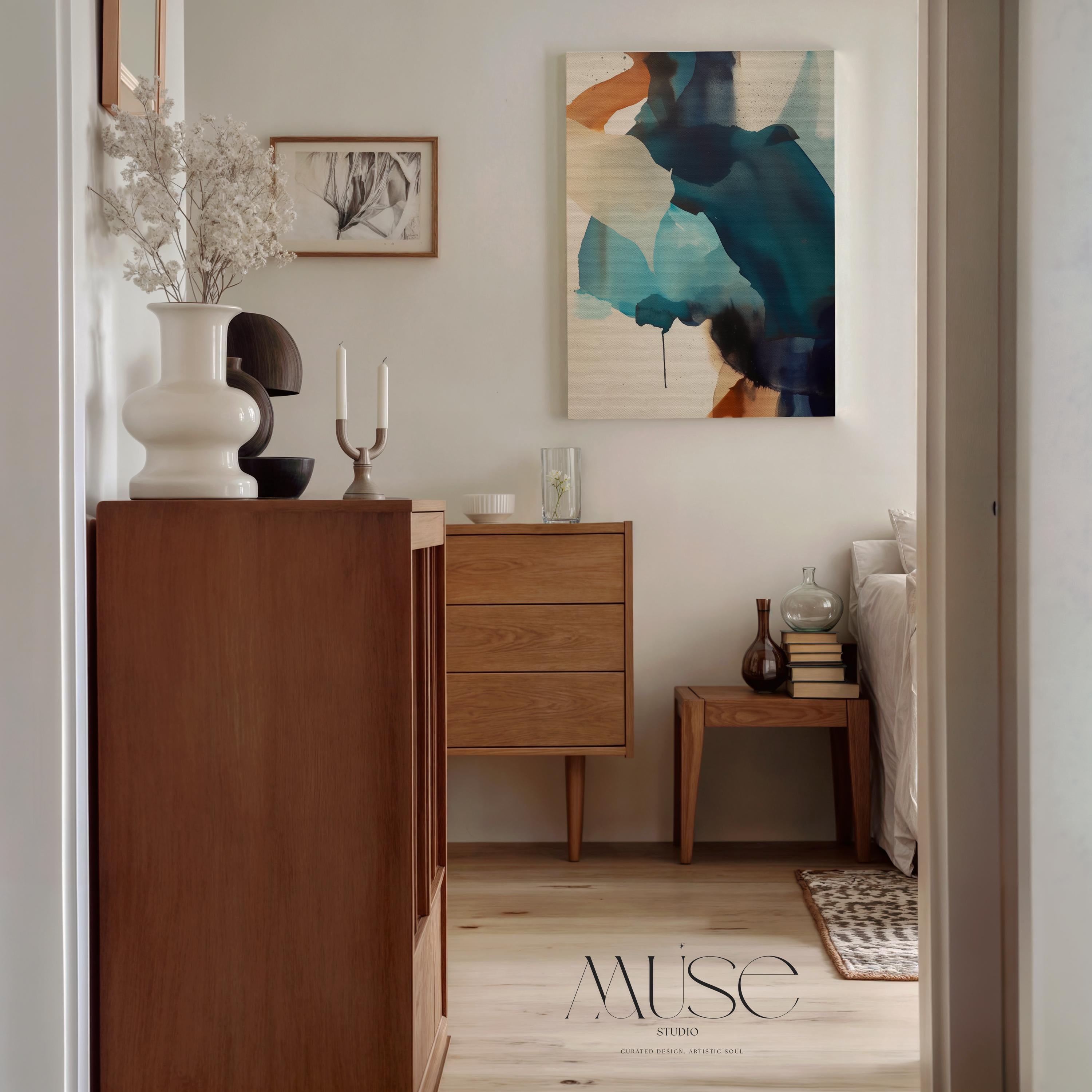 Vertical gallery-wrapped canvas featuring an abstract composition of teal, deep navy, soft aqua, and sand with fluid, ink-like motion across a neutral base. This nature-inspired wall art adds a tranquil, contemporary presence to coastal interiors, entryways, or stairwells. A soft modern statement piece, available as canvas or floating framed wall art from Muse Studio.