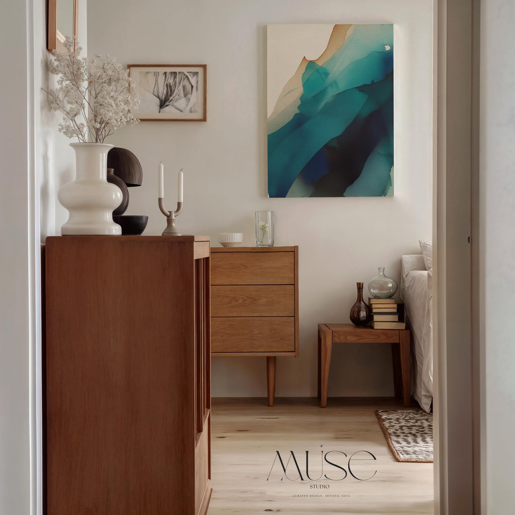 Vertical canvas wall art featuring deep teal, navy, aqua, and soft sand tones in a fluid, ink-wash abstract style. This nature-inspired design blends organic motion with a tranquil, modern aesthetic—perfect for soft contemporary interiors, stairwells, or coastal-inspired living rooms. Available as a gallery-wrapped or floating frame canvas from Muse Studio for designer-level wall styling.