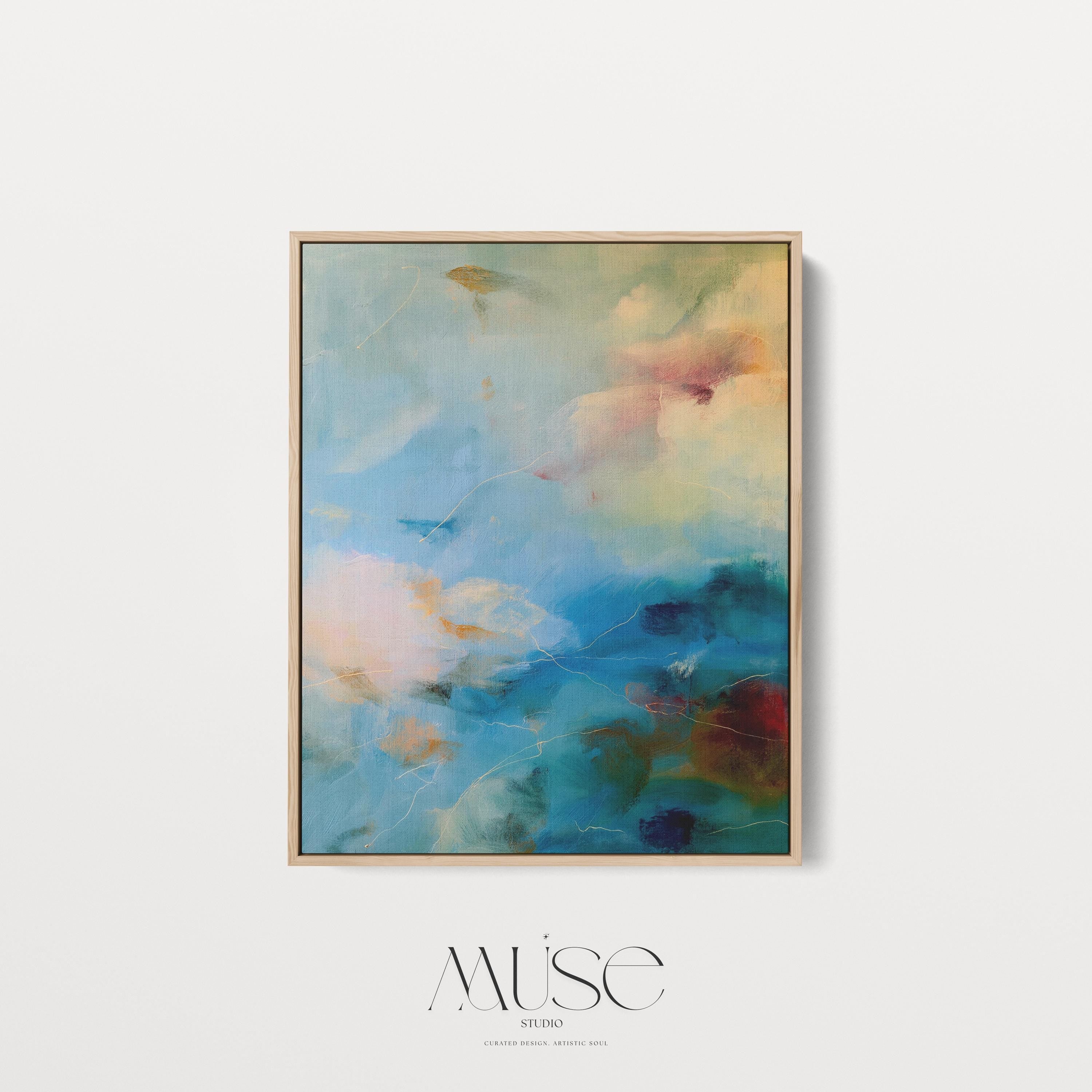 Vertical canvas wall art featuring an abstract blend of teal, cream, ocean blue, and earthy green. This soft color composition evokes the serenity of coastal skies and natural light. Ideal for tranquil interiors such as a spa, entryway, or bedroom retreat, this piece suits warm minimalist and nature-inspired decor styles. Available as a gallery-wrapped stretched canvas, framed canvas, or fine art print. Original artwork by Muse Studio.