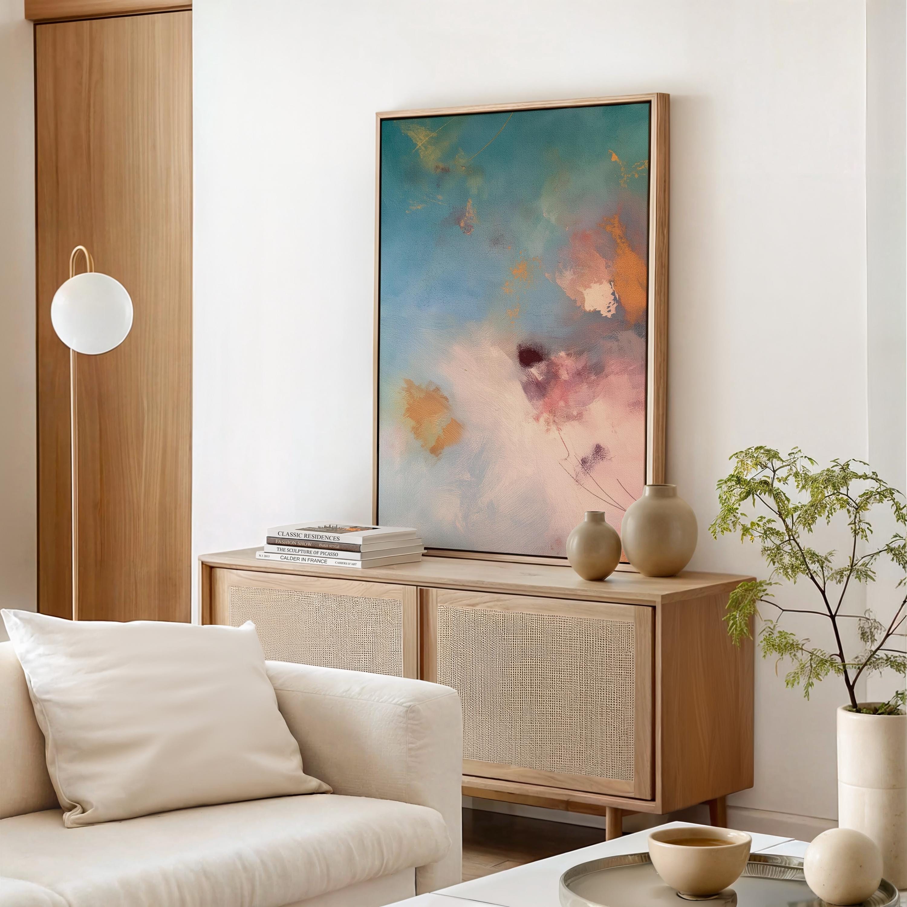 Vertical canvas wall art in soft pastels featuring abstract brushwork in peach pink, sky blue, honey gold, and blush. This gentle and calming piece evokes a sunrise or soft floral bloom, perfect for spa-style bathrooms, feminine bedrooms, or serene entryways. Complements soft contemporary and warm minimalist interiors. Available as a gallery-wrapped stretched canvas, framed canvas, or giclée fine art print. Original artwork by Muse Studio.