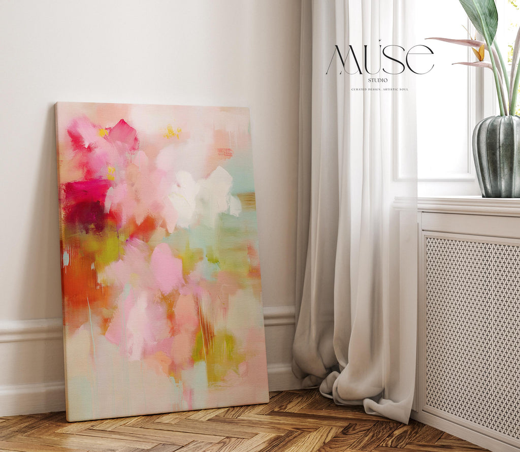 Large vertical abstract canvas wall art featuring blush pink, coral, and mint green tones in a pastel botanical style. Designed as a giclée print, this artwork evokes spring freshness and painterly movement, perfect for bedrooms, living rooms, or entryways. Its oversized format creates a bright, uplifting focal point. Available as a gallery-wrapped large canvas giclée print in multiple sizes for curated, designer-inspired interiors.